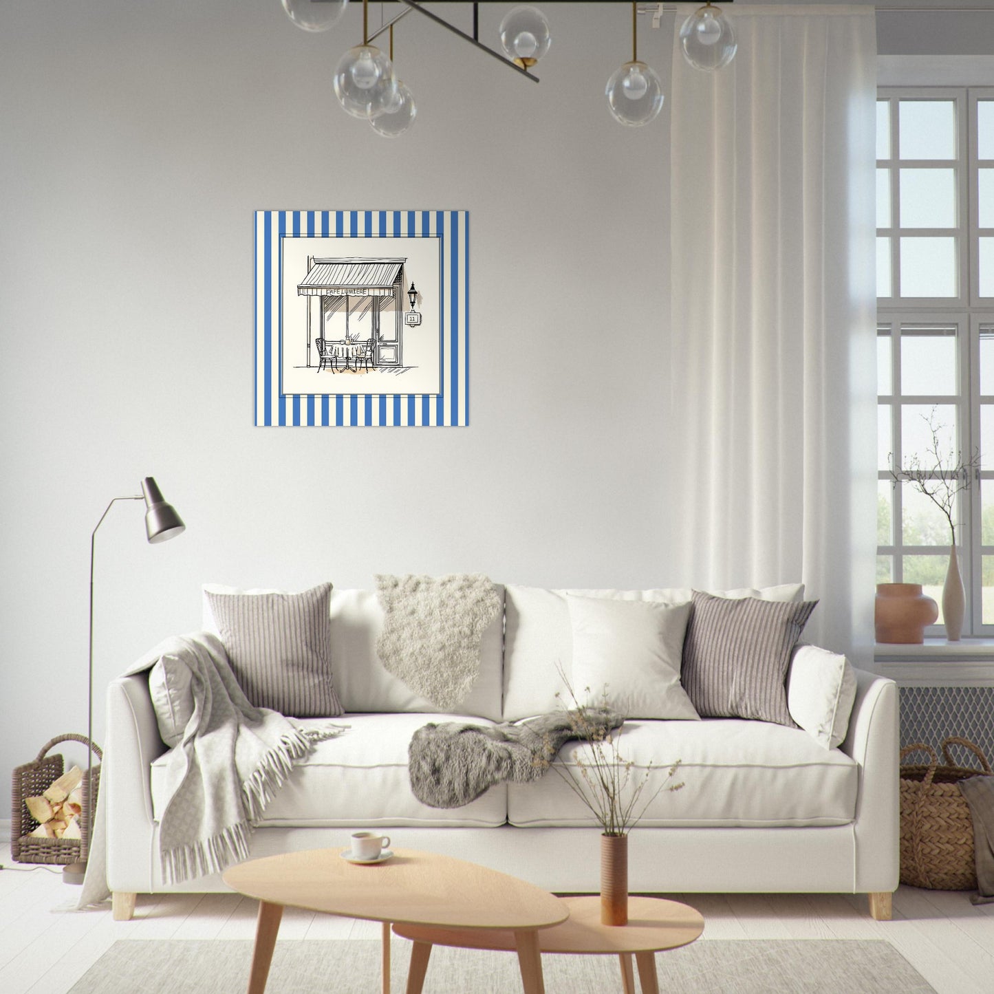 French café storefront art print in blue above sofa in bright living room