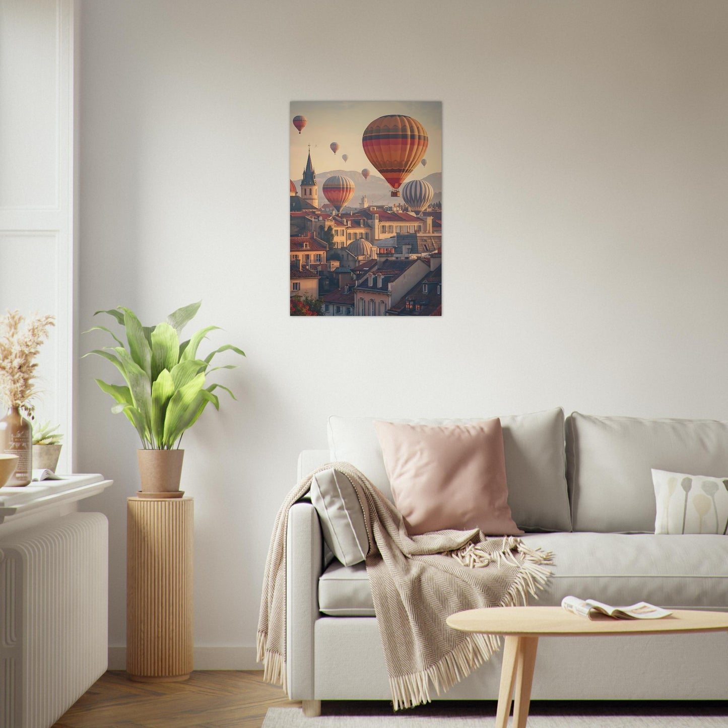 Living room with a sofa, coffee table, and wall art of hot air balloons over a city.