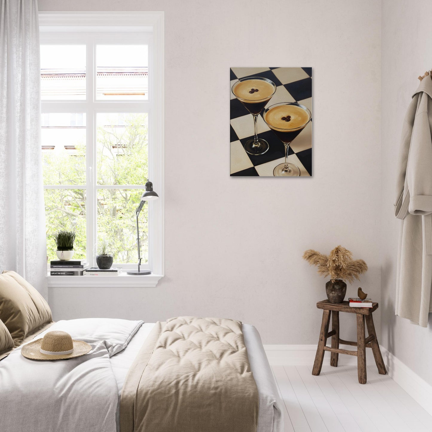 A canvas wall art depicting two cocktails on a black-and-white checkered background, displayed above a neatly made bed in a bright, modern bedroom.