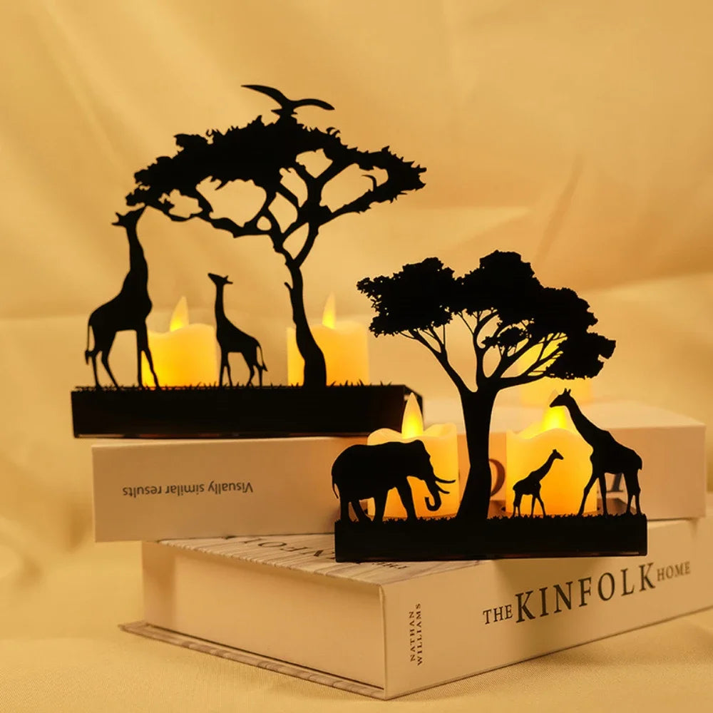 Decorative set with black animal silhouettes on books against a warm background