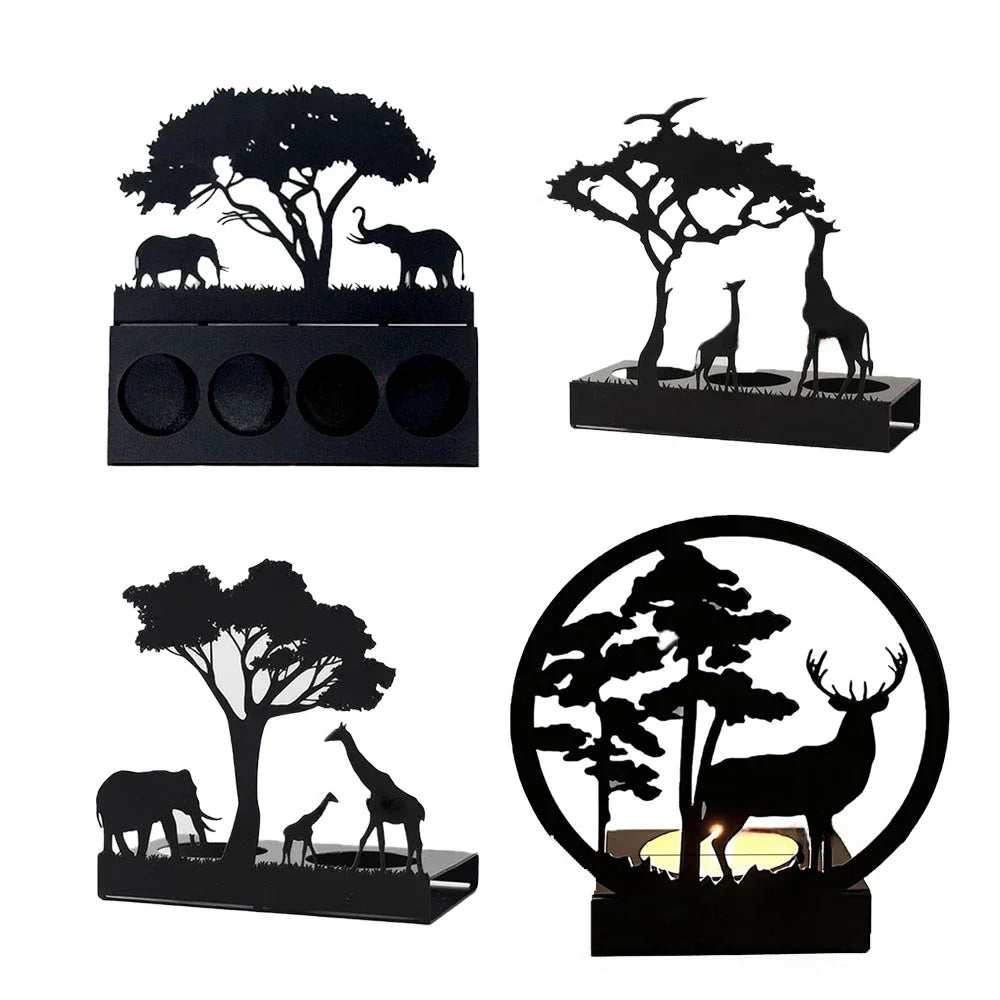 Set of decorative metal art candle holders with animal silhouettes on a white background