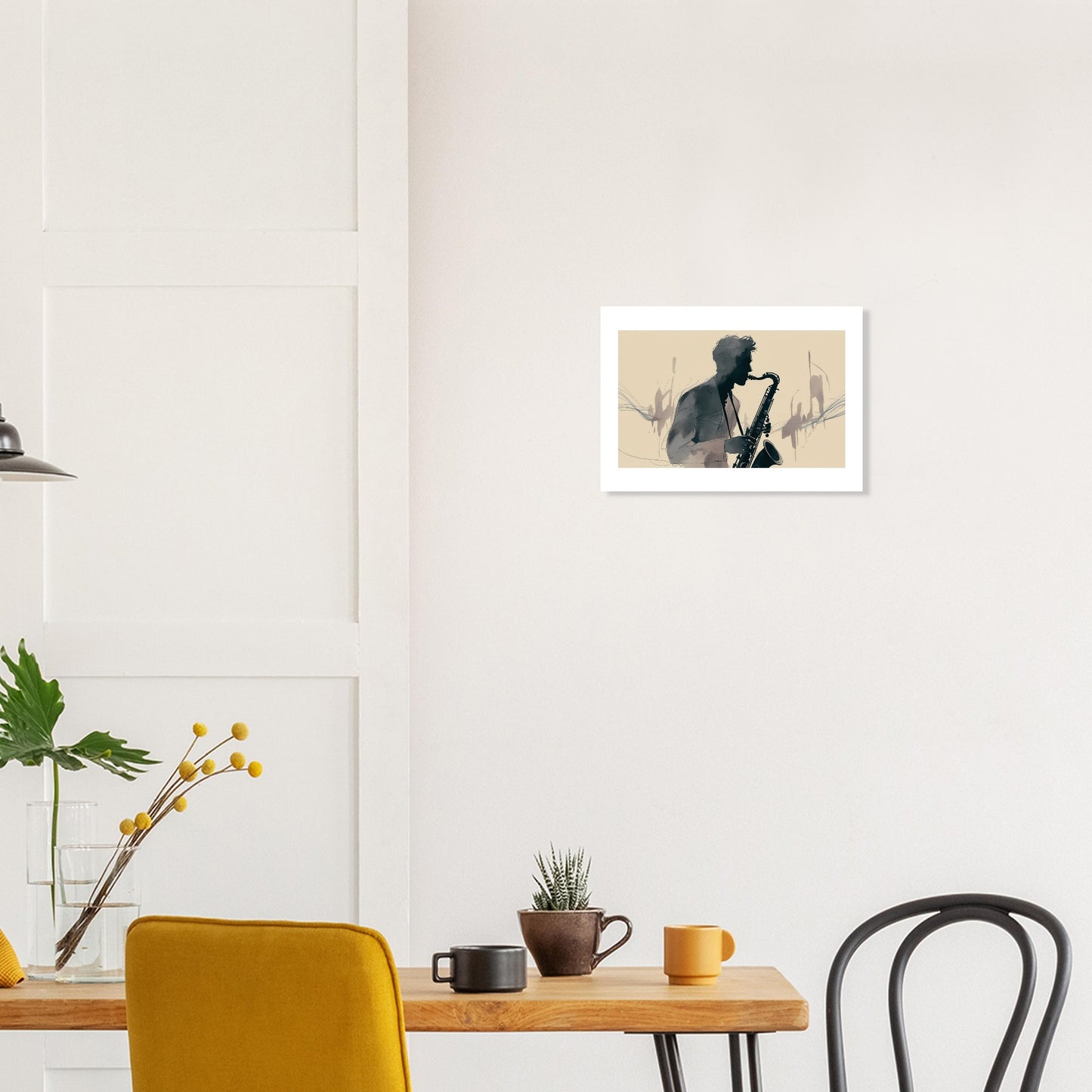 Framed artwork of a person playing a saxophone on a wall above a table with decor items.
