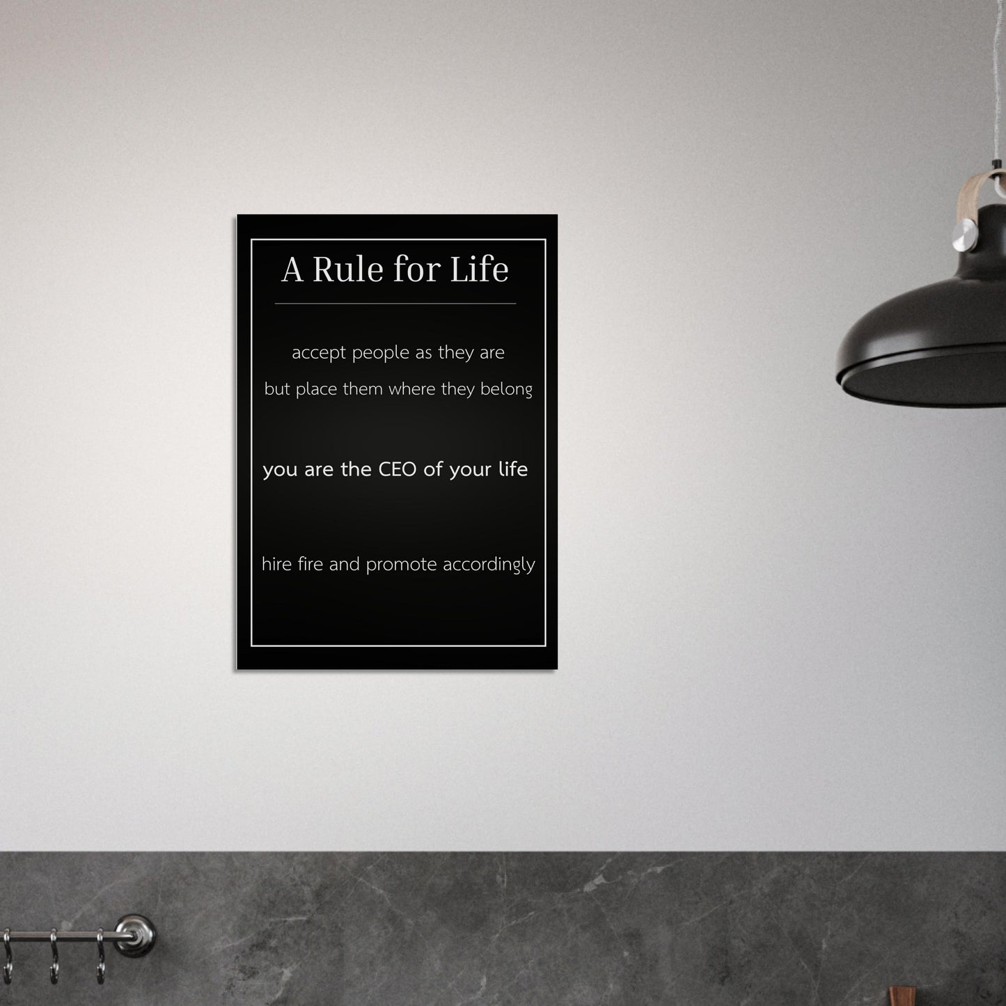 Framed poster with 'A Rule for Life' quote on a wall.