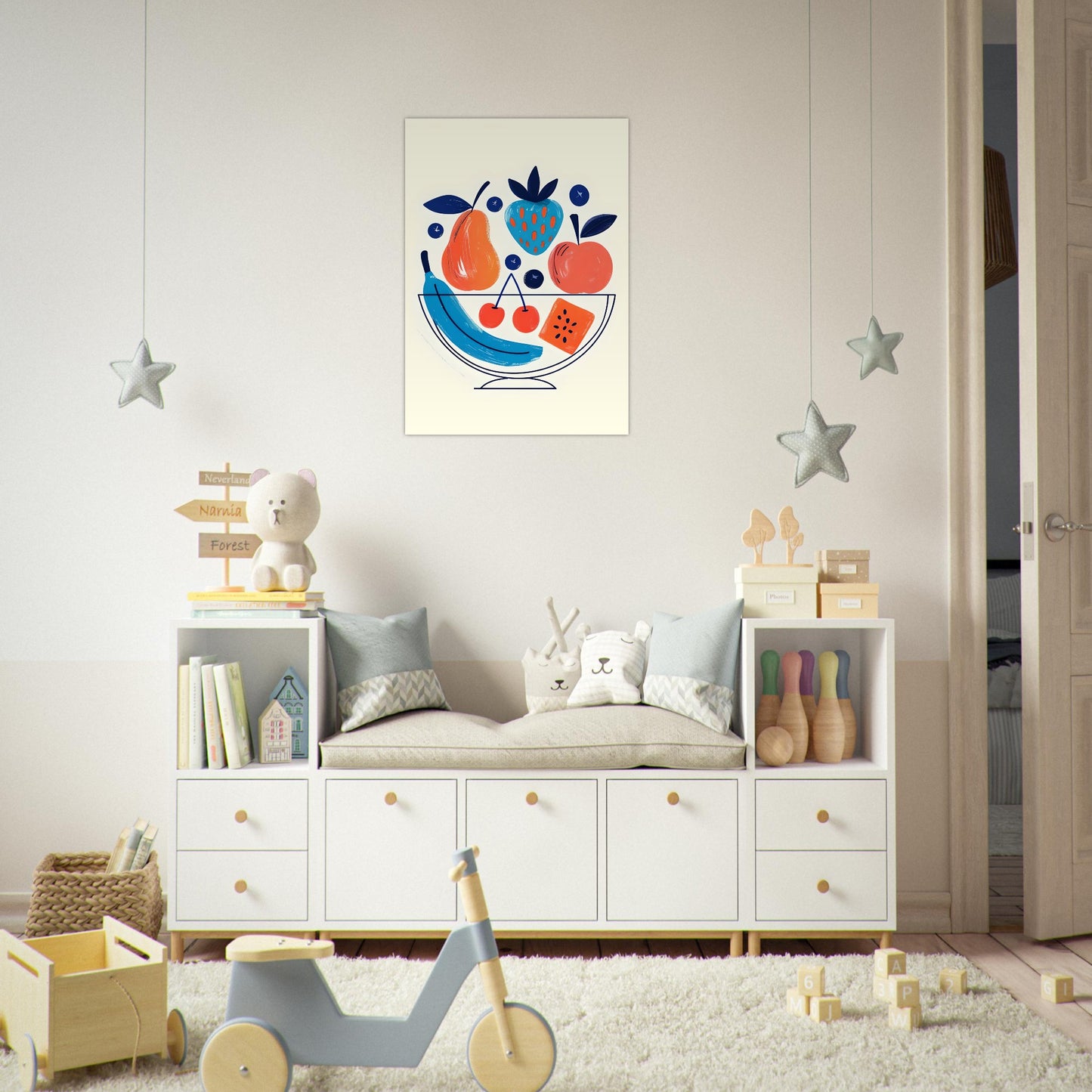 Children's room with a white dresser, toys, and a colorful fruit painting on the wall.