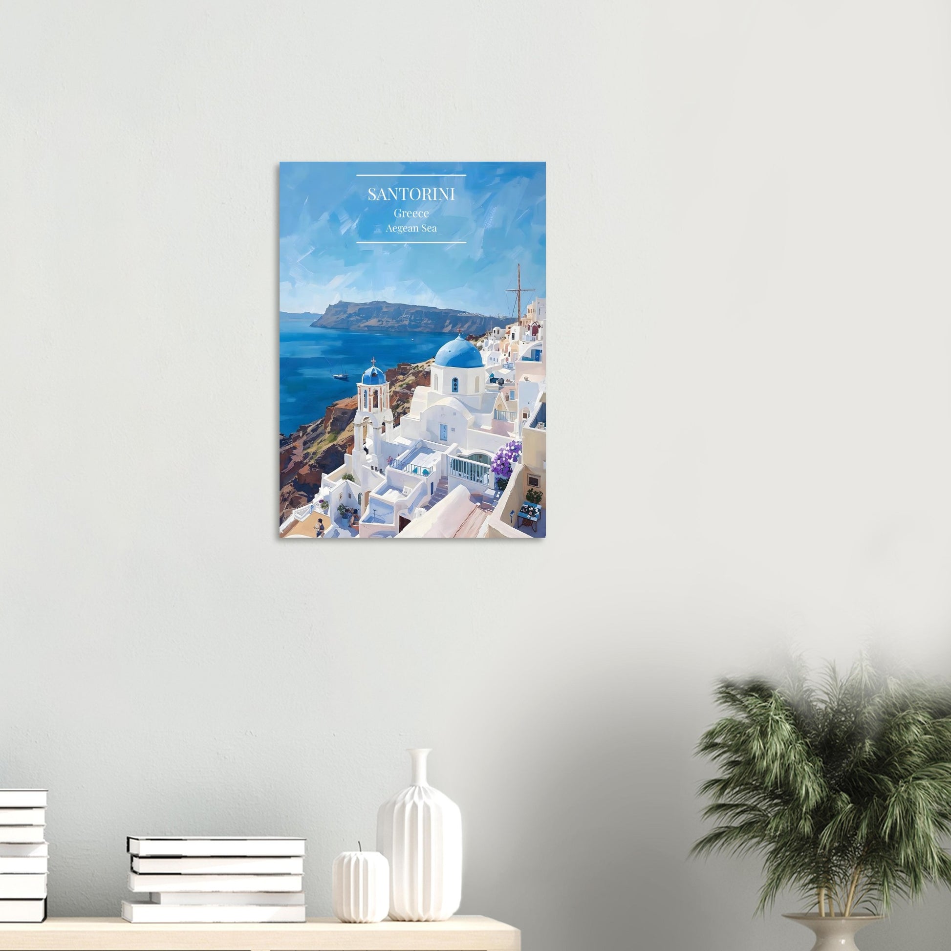 Poster of Santorini with a white wall and decorative items on a shelf.