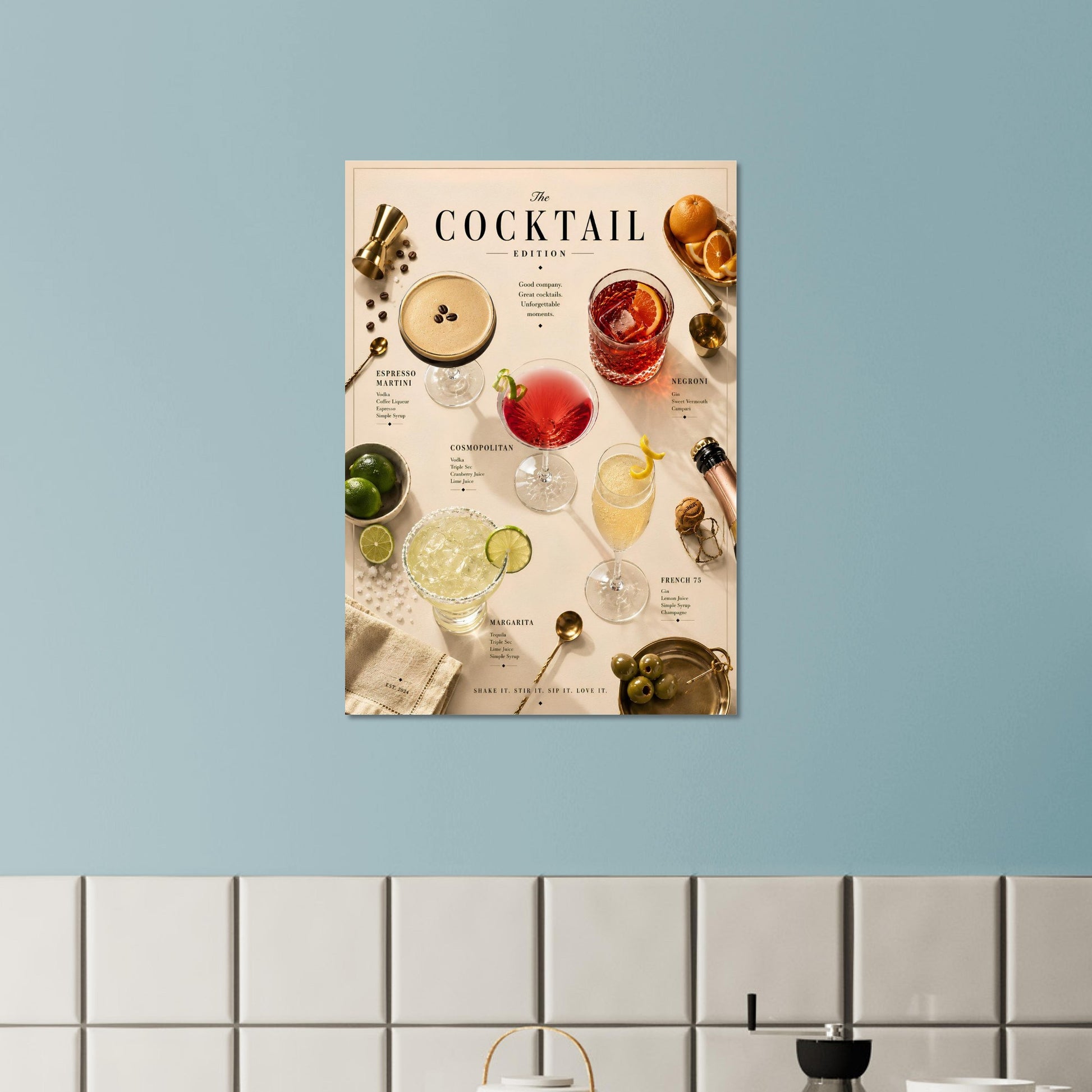 Cocktail-themed wall art on a light blue wall above a white tiled shelf.