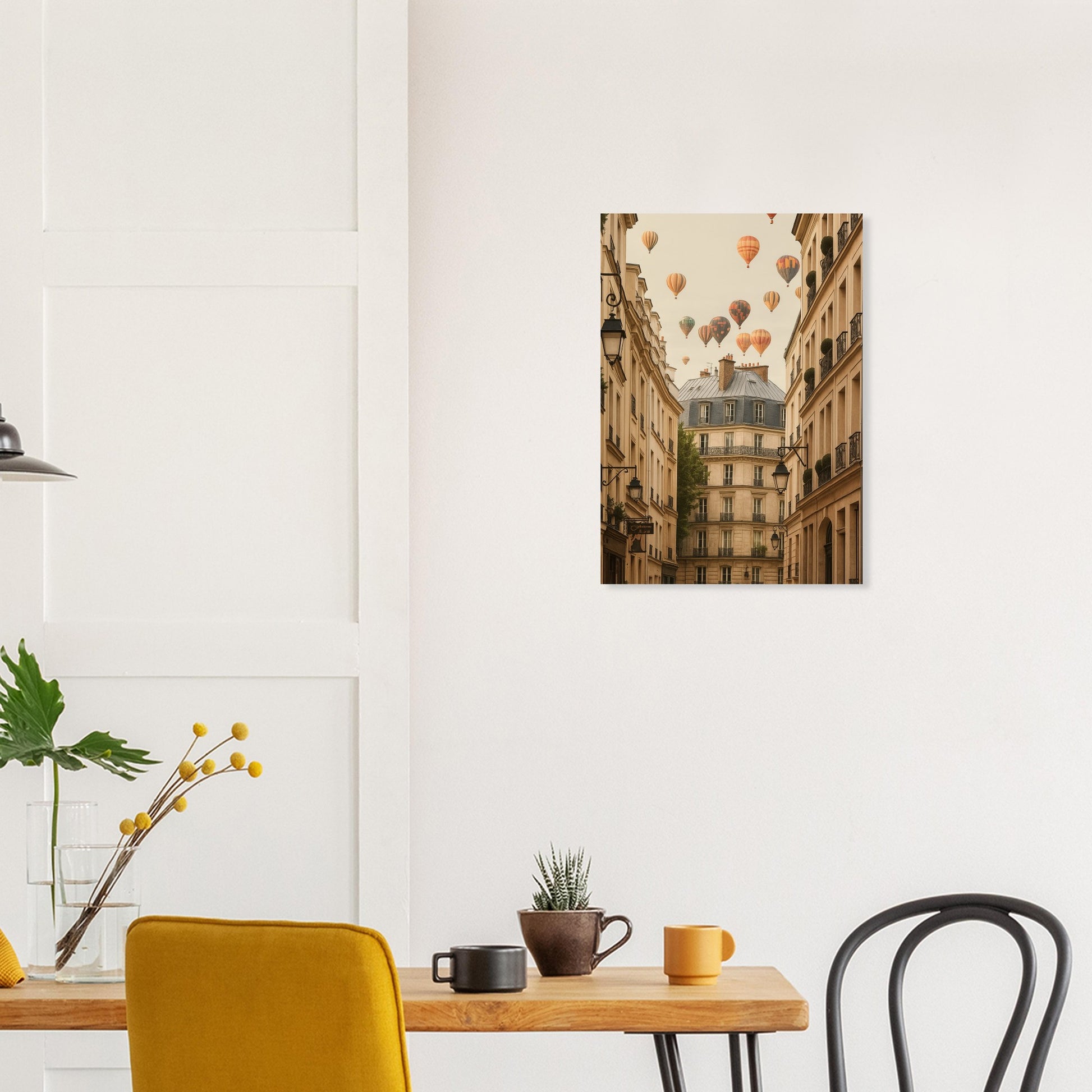 Room interior with a table, chairs, and a wall art print of hot air balloons over buildings.