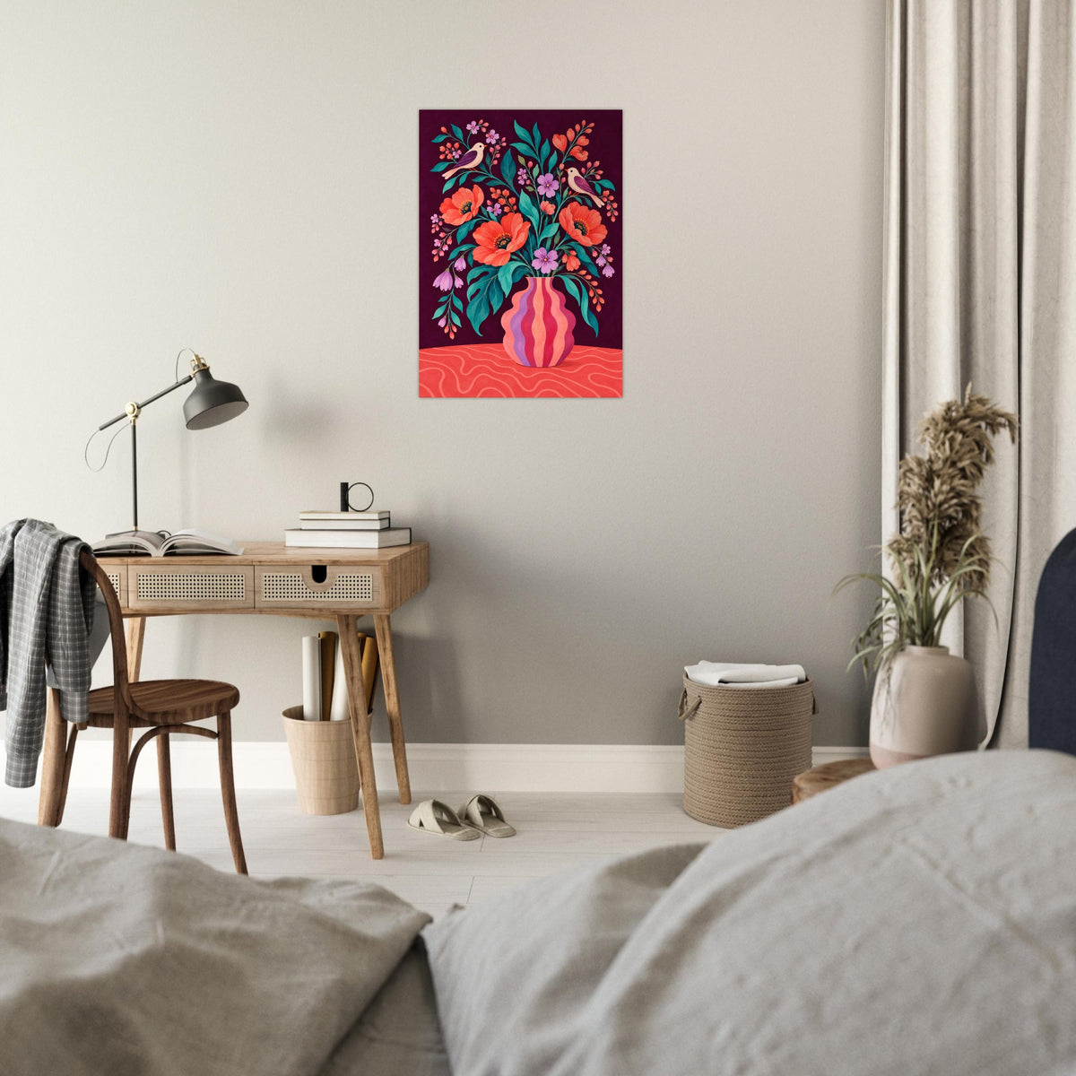 A colorful floral art print featuring a pink vase with vibrant flowers, displayed on a light gray wall in a modern, styled bedroom setting.