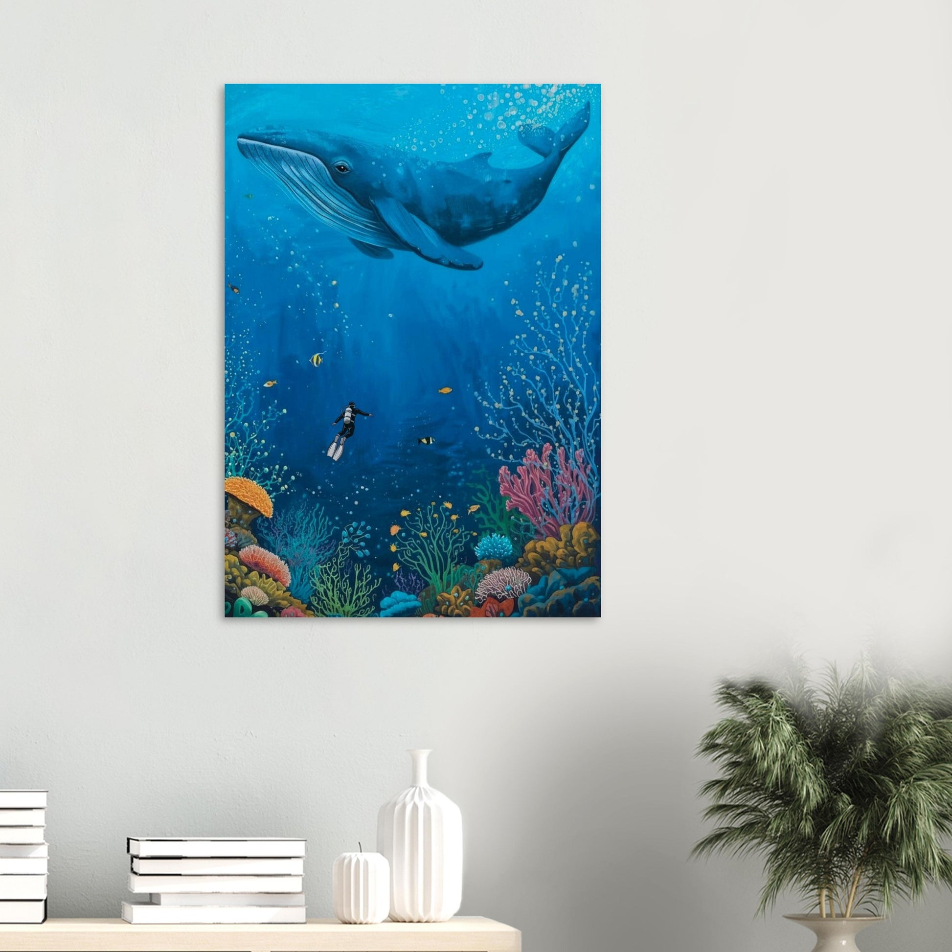 Canvas print of an underwater scene with a whale and diver, displayed on a wall.