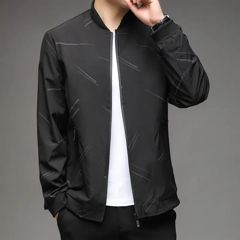 Black jacket worn by a person on a gray background