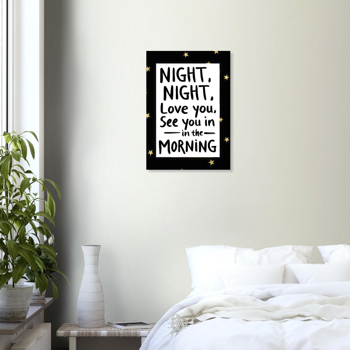 Framed artwork with a quote above a bed in a bedroom setting