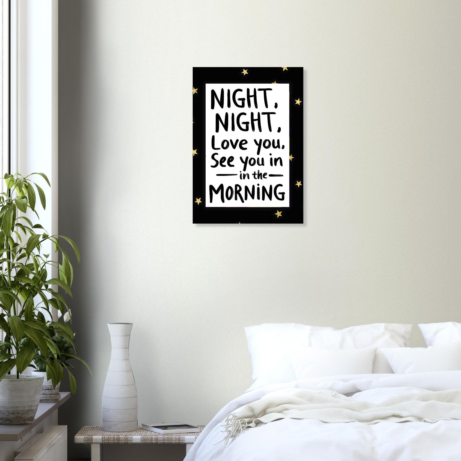 Framed artwork with a quote above a bed in a bedroom setting