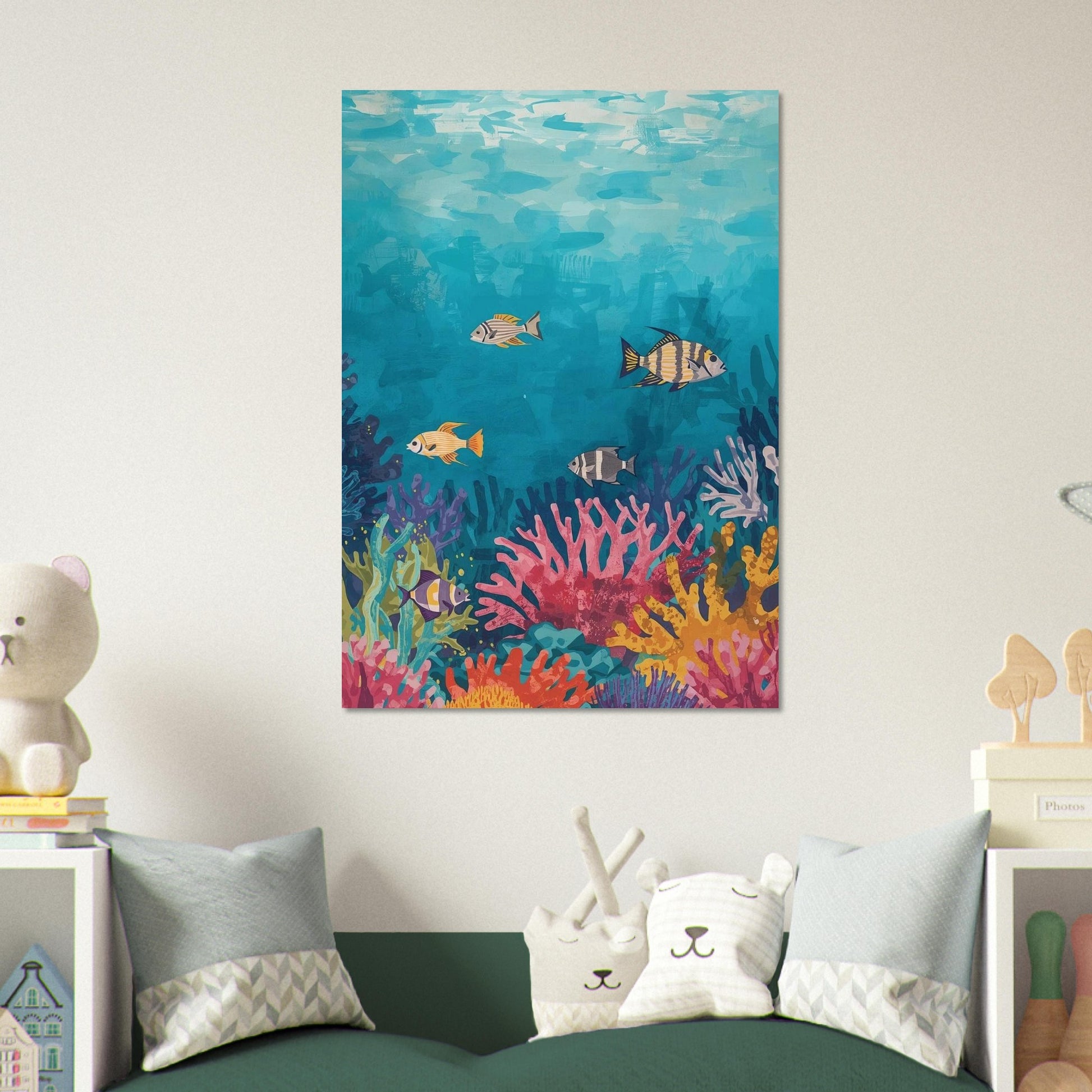 Colorful underwater scene painting on a wall above a bed with decorative pillows.