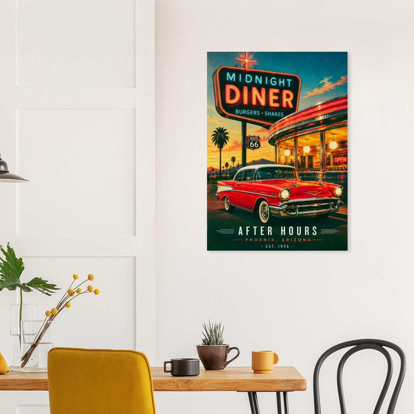 Poster of a diner with a red car on a wall above a table with chairs.