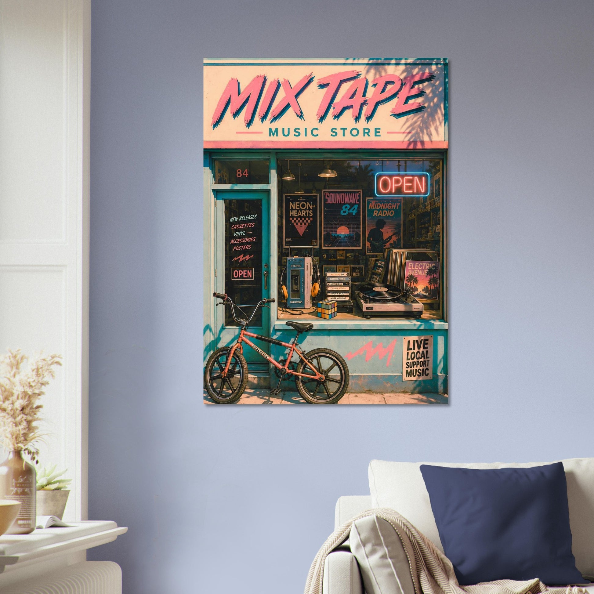 Poster of a retro 80s music store named 'Mix Tape' on a wall above a sofa.