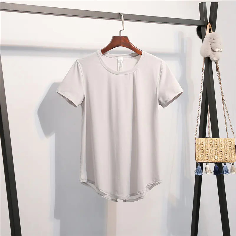 White t-shirt on a hanger against a white background
