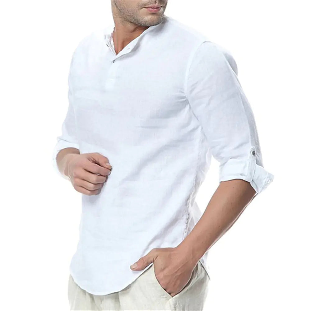Man wearing a white shirt with rolled-up sleeves on a white background