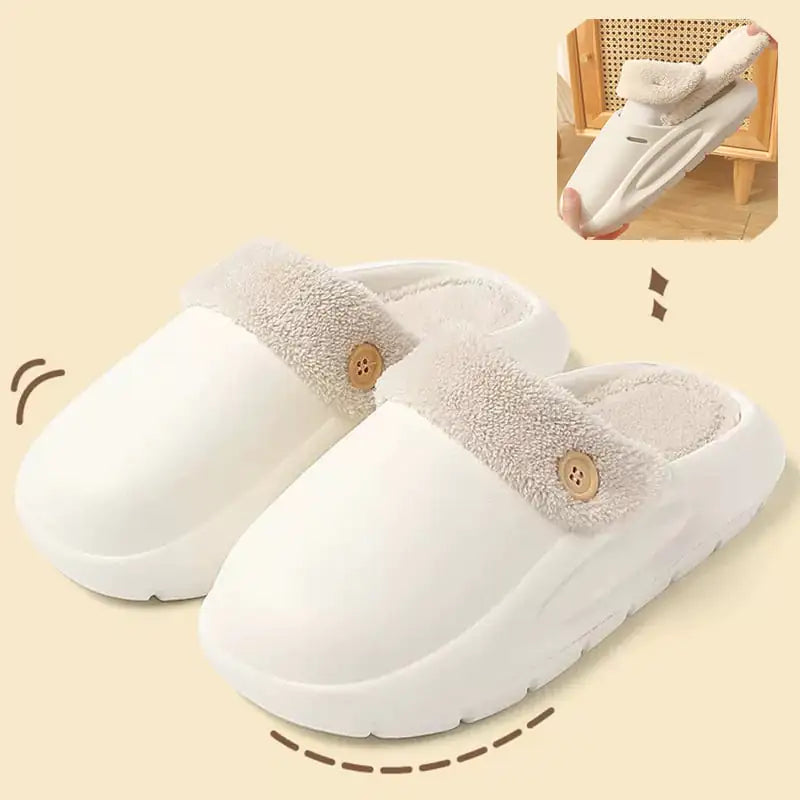 White slippers with fluffy trim on a beige background