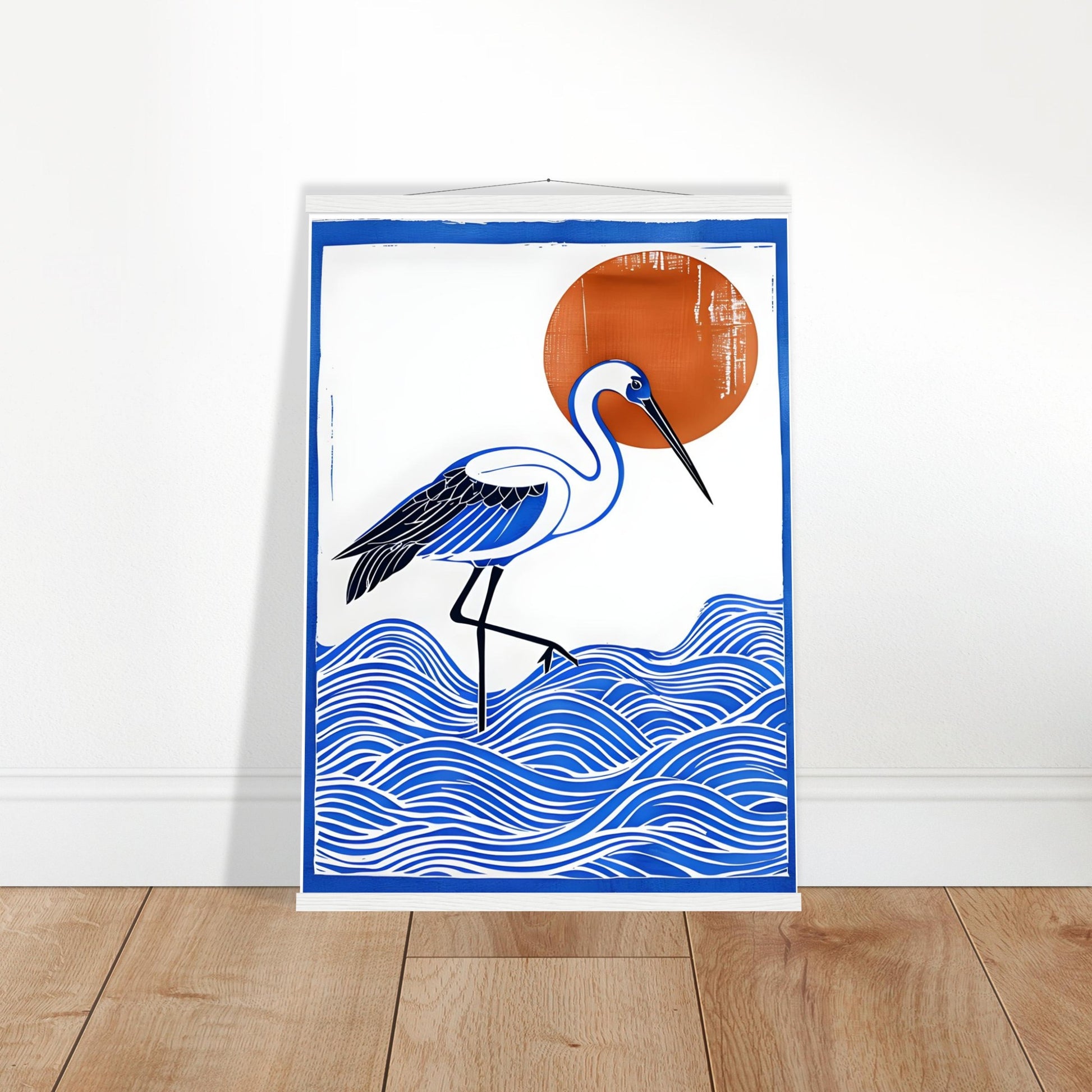 Poster with a blue and white bird design on a white wall.