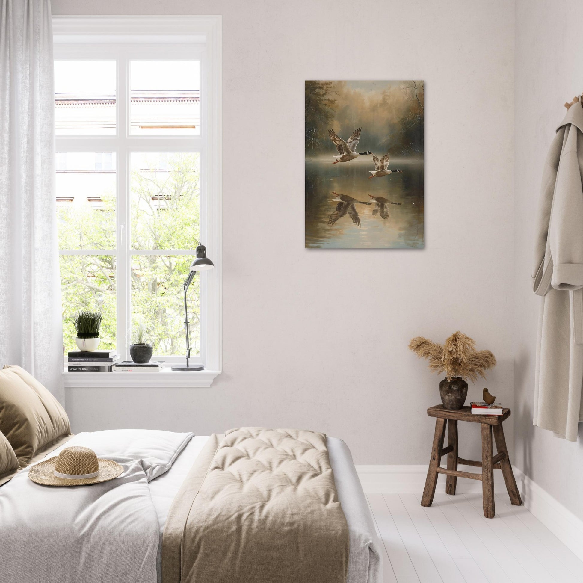 Bedroom with a painting of geese on a lake above a bed