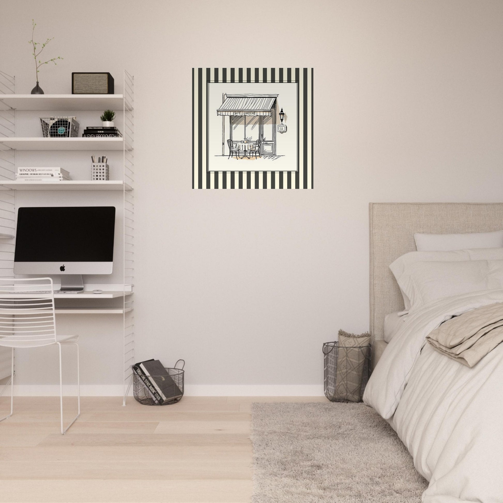 Black and cream Paris café art print displayed in soft neutral bedroom