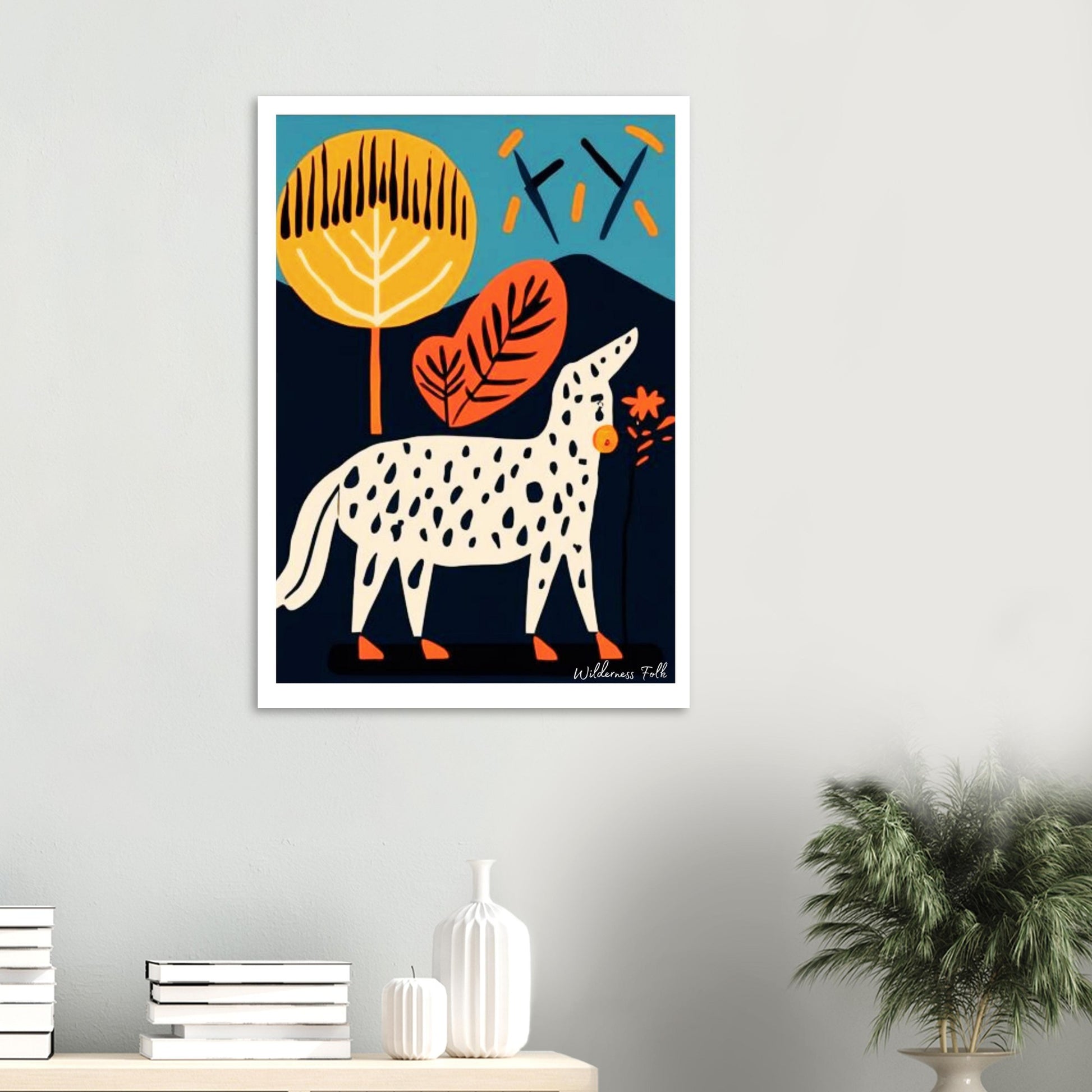 Framed artwork of a stylized animal with abstract leaves and trees on a wall.