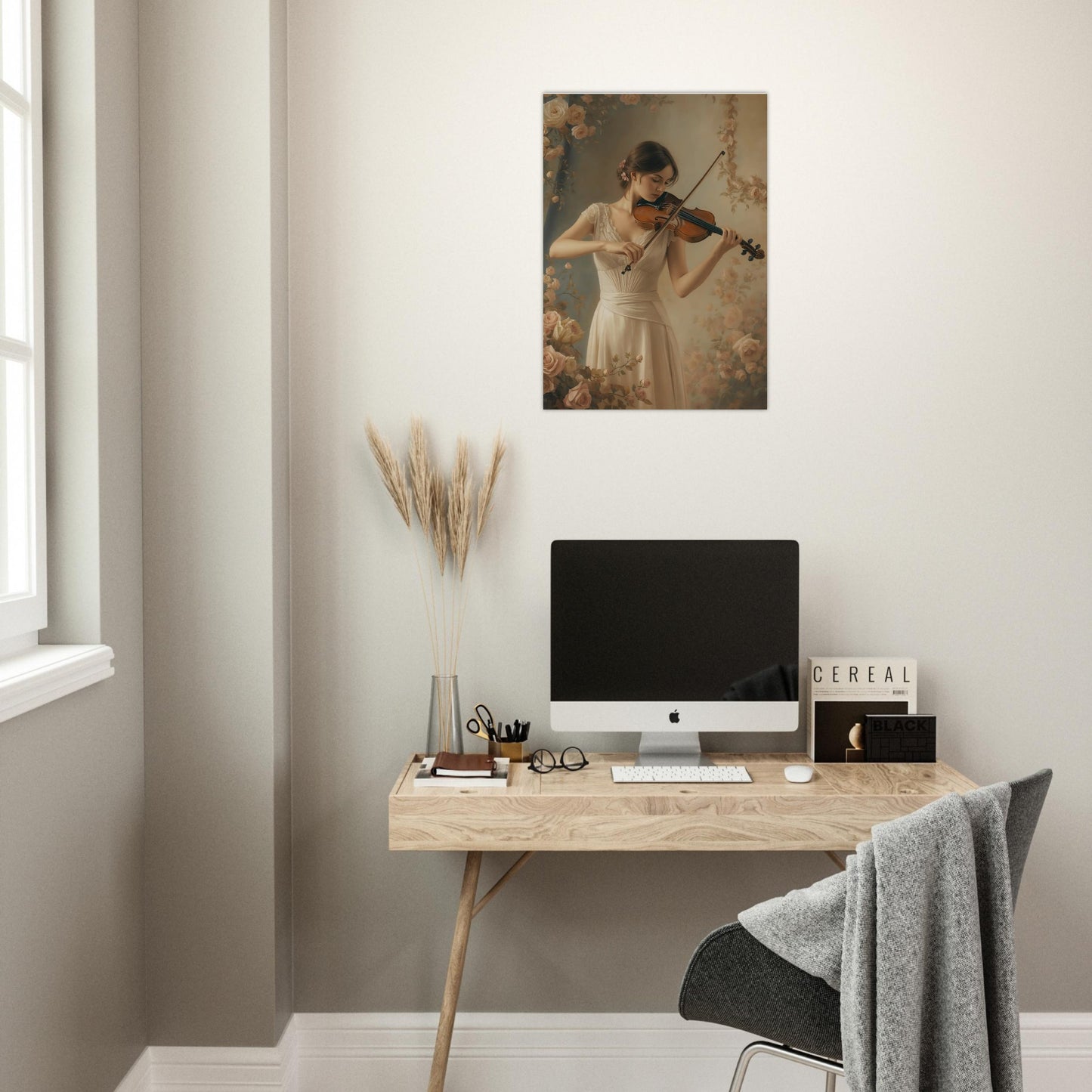 Modern home office with a desk, computer, and wall art of a woman playing the violin.