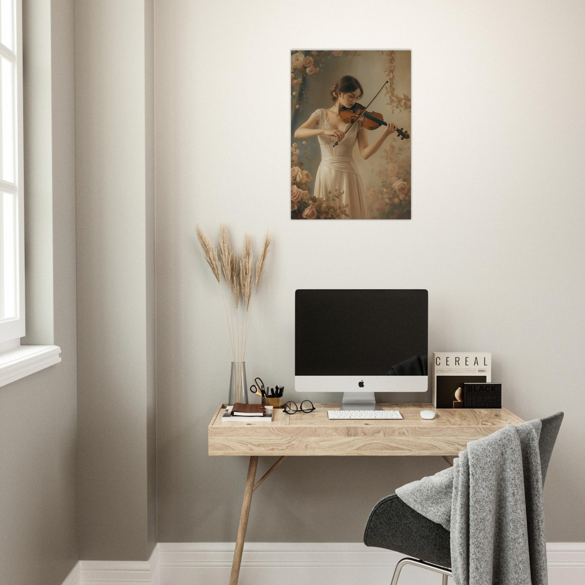 Modern home office with a desk, computer, and wall art of a woman playing the violin.