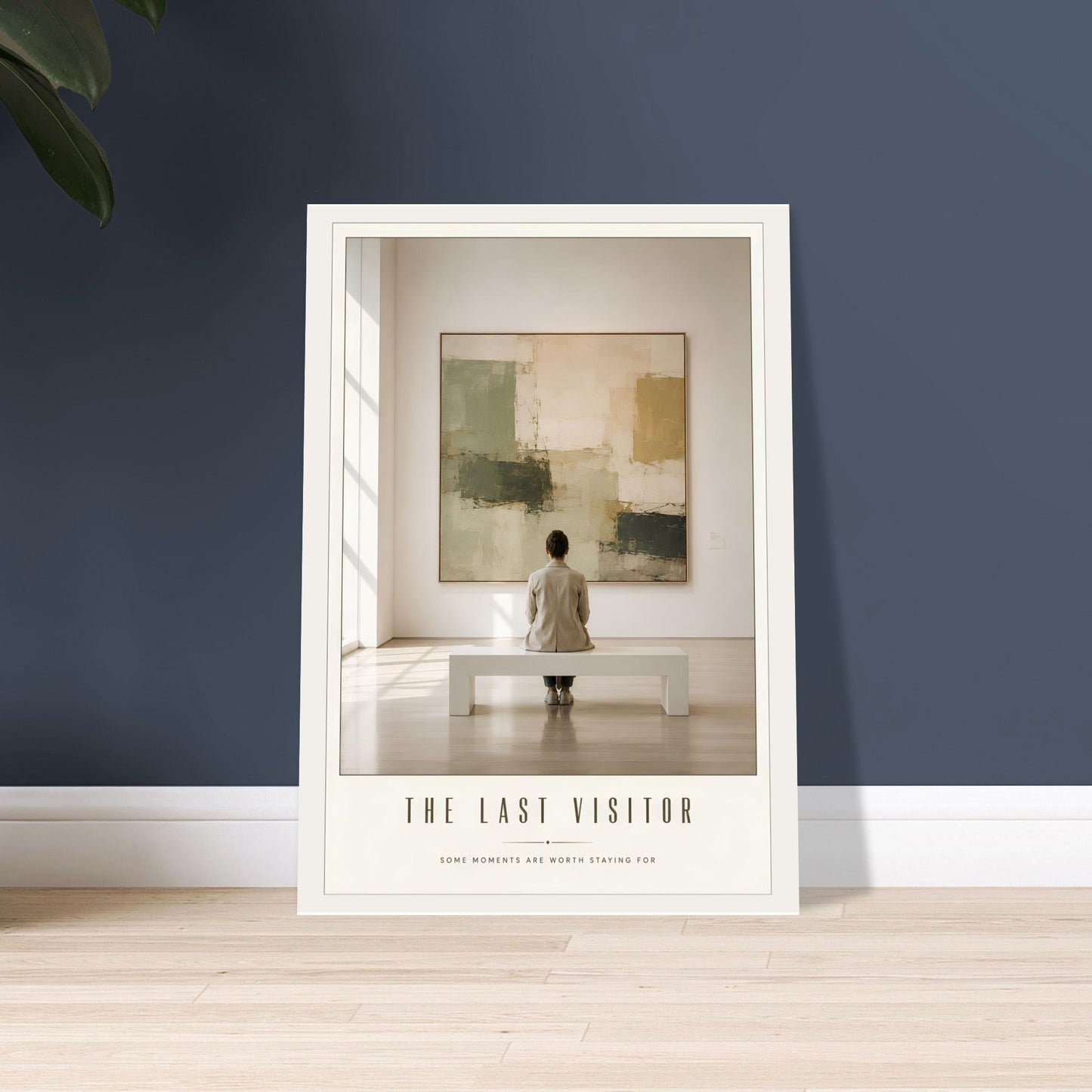 Framed artwork titled 'The Last Visitor' on a wall with a person standing in front of a painting.