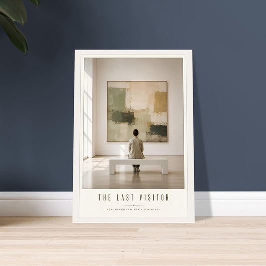 Framed artwork titled 'The Last Visitor' on a wall with a person standing in front of a painting.