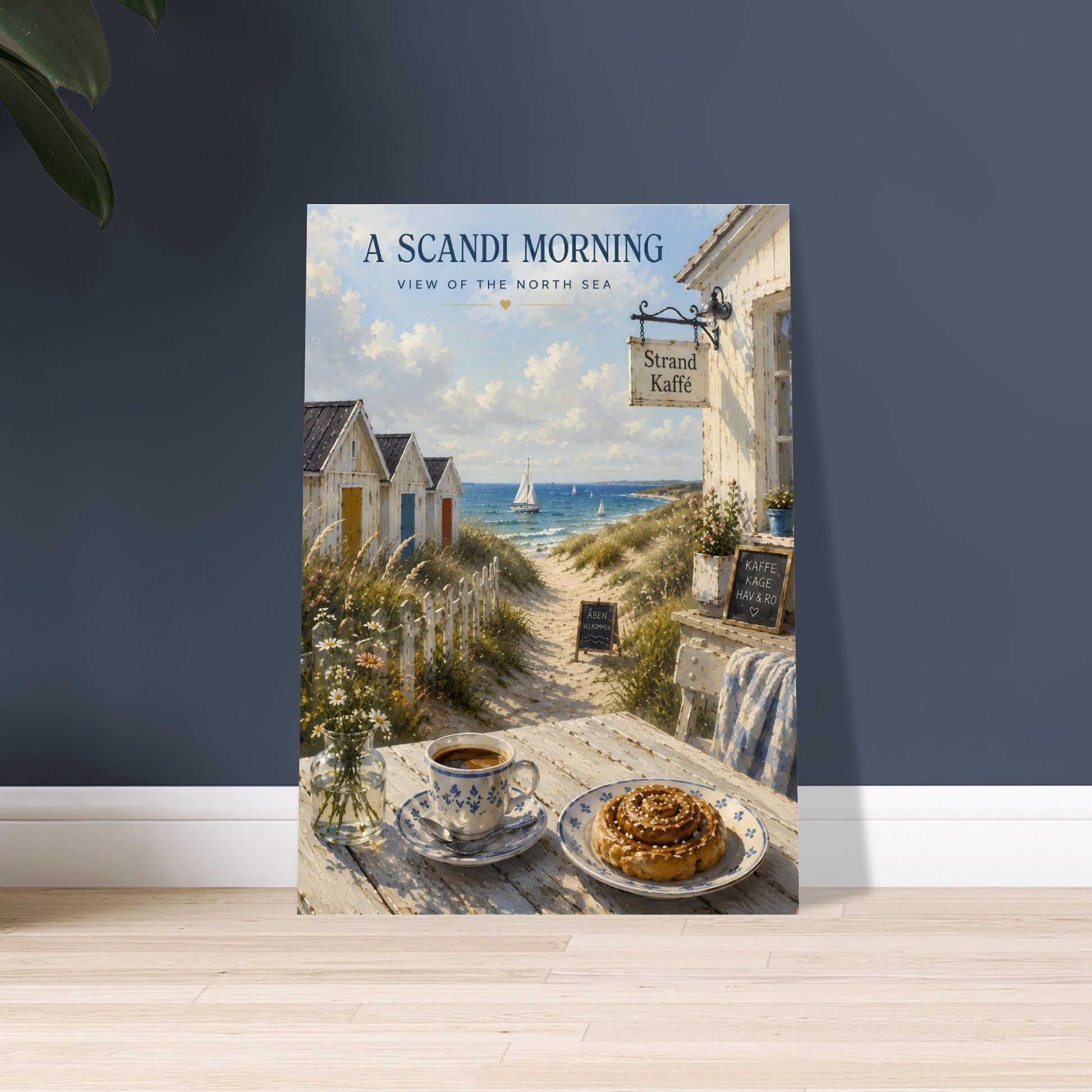 Scandinavian wall art displayed against a dark feature wall featuring a Nordic coastal café and beach huts