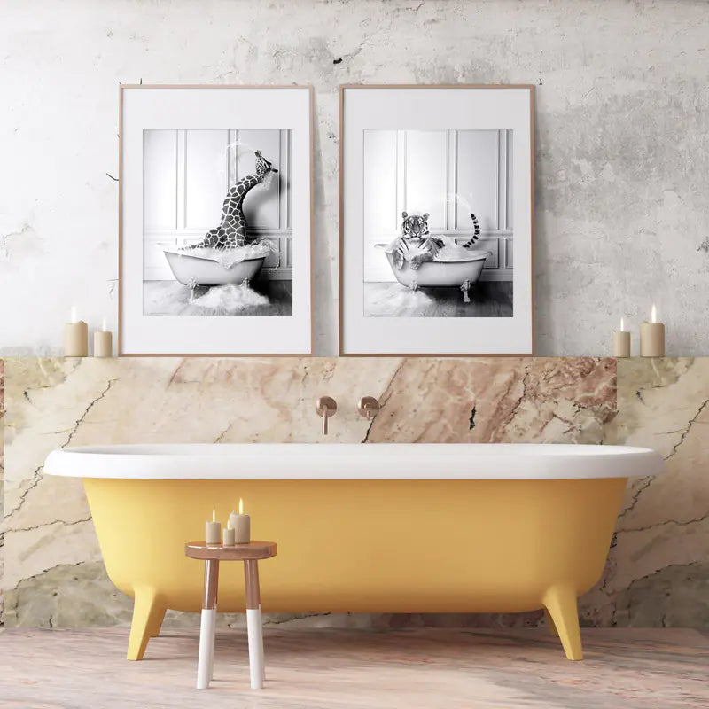 Yellow freestanding bathtub in a bathroom with framed black and white photos of animals in bathtubs.