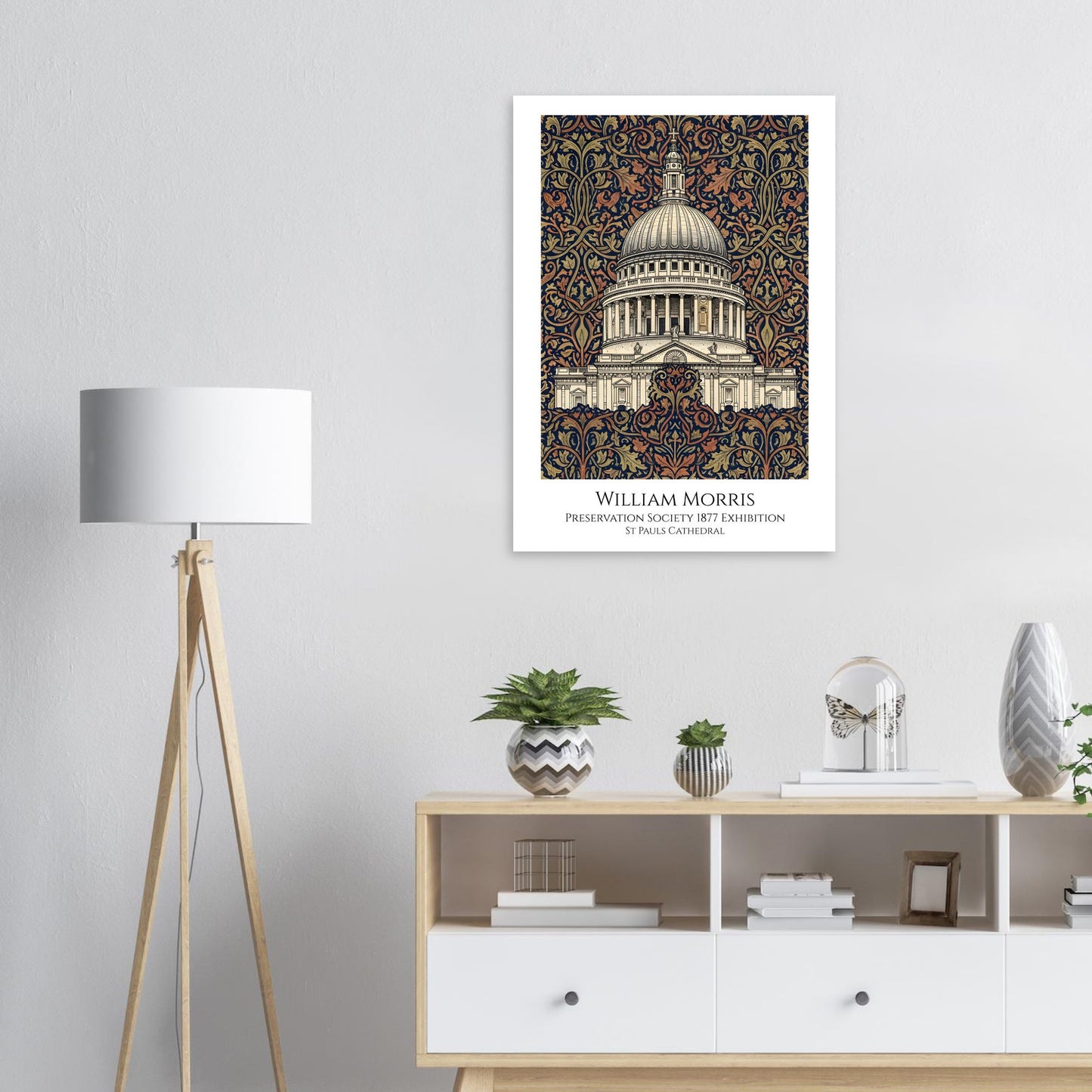 Decorative poster of a building on a wall above a wooden shelf with decor items.