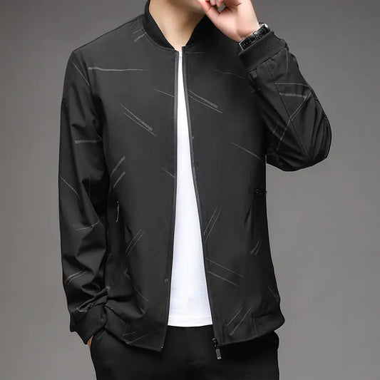 Black jacket worn by a person on a gray background