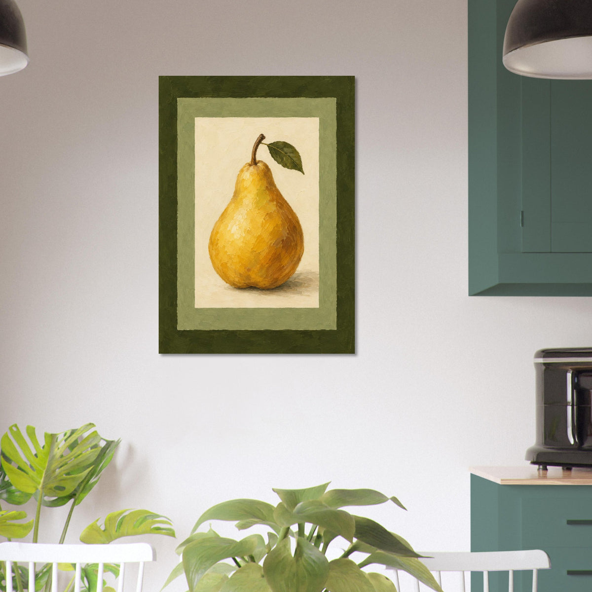 A framed art print of a yellow pear with a green leaf, displayed on a white wall in a kitchen setting with green plants and teal cabinets.