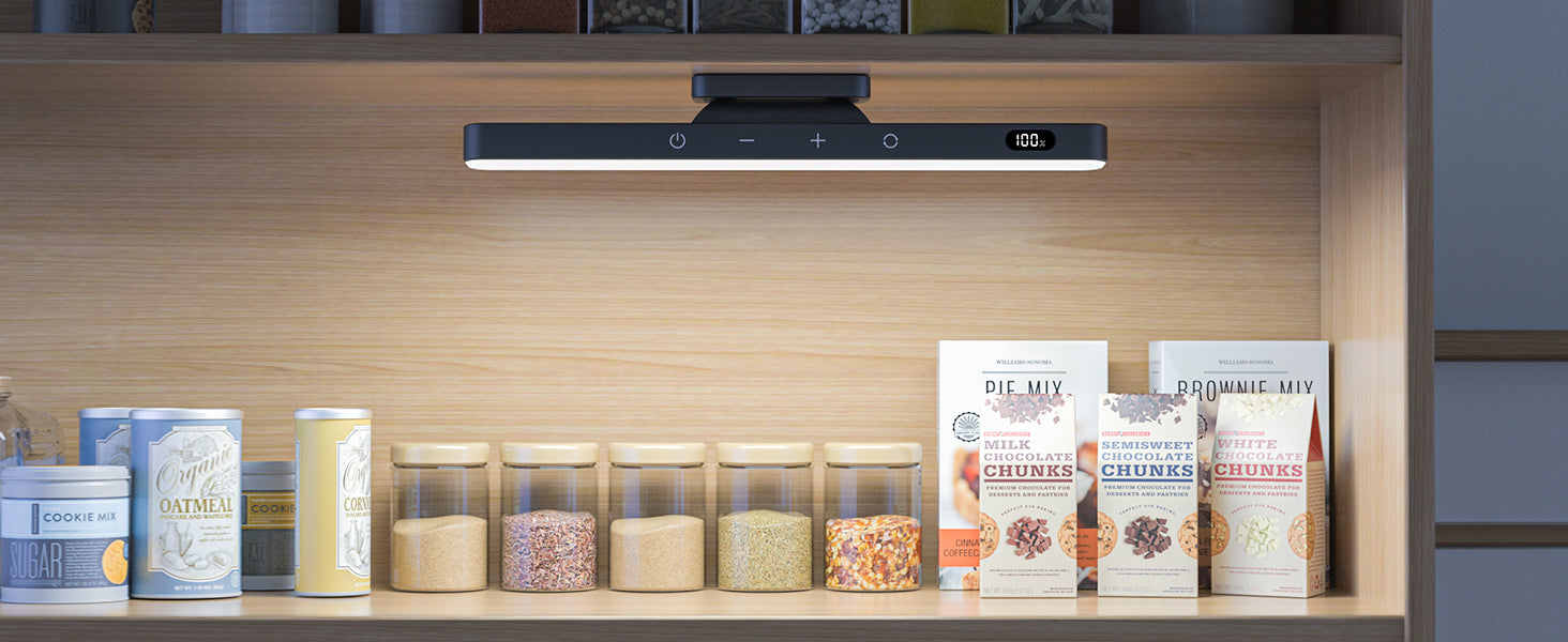 Light product above a Shelf with various food products and a digital display above it.