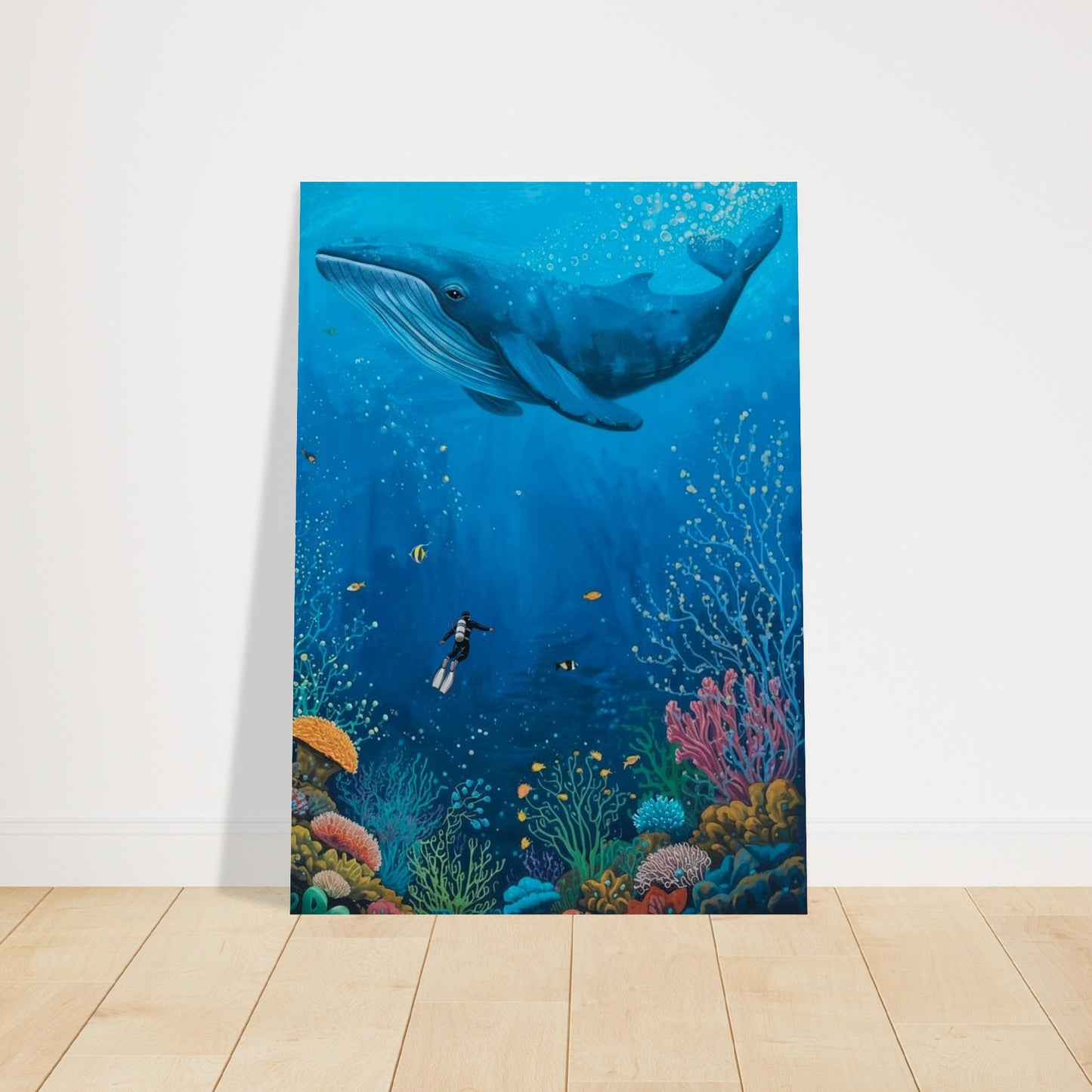 Poster of a whale and underwater scene on a white wall.