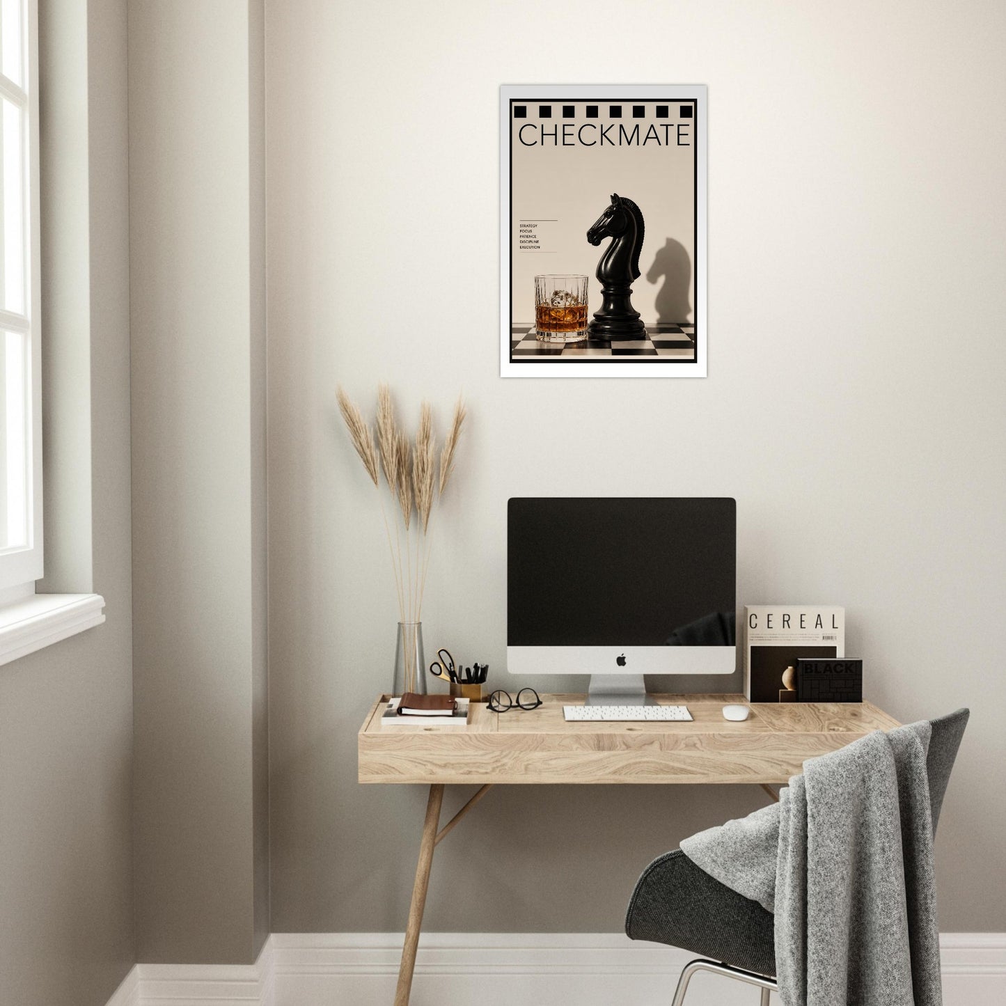 Modern office setup with a desk, computer, and a Checkmate chess poster displayed