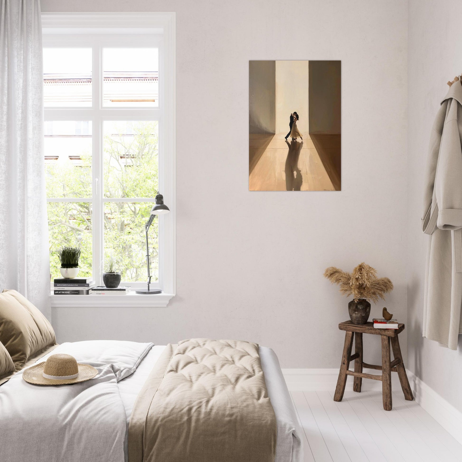 Neatly decorated bedroom with a bed, window, and wall art.
