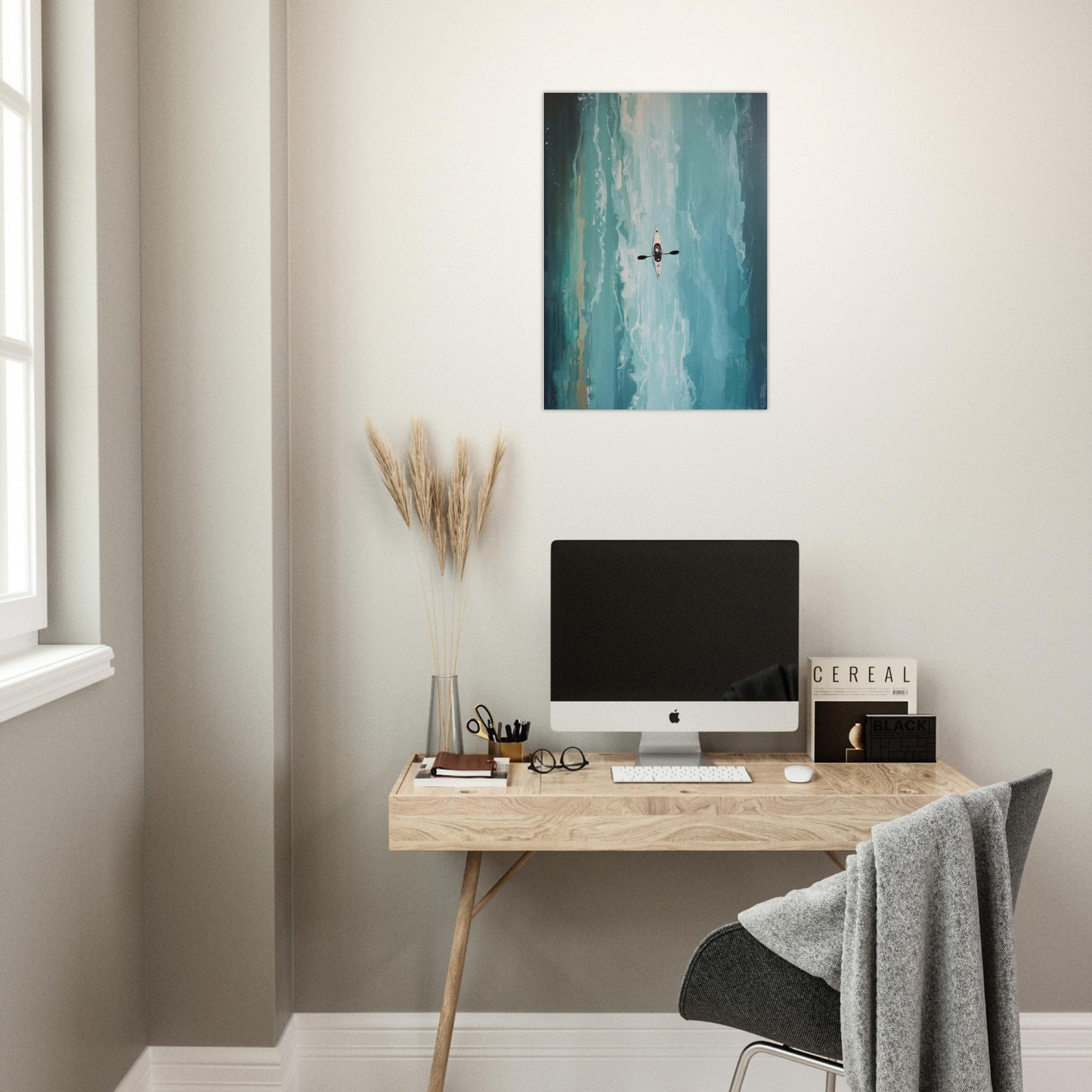 Modern home office with a desk, computer monitor, and Turquoise ocean kayak wall art