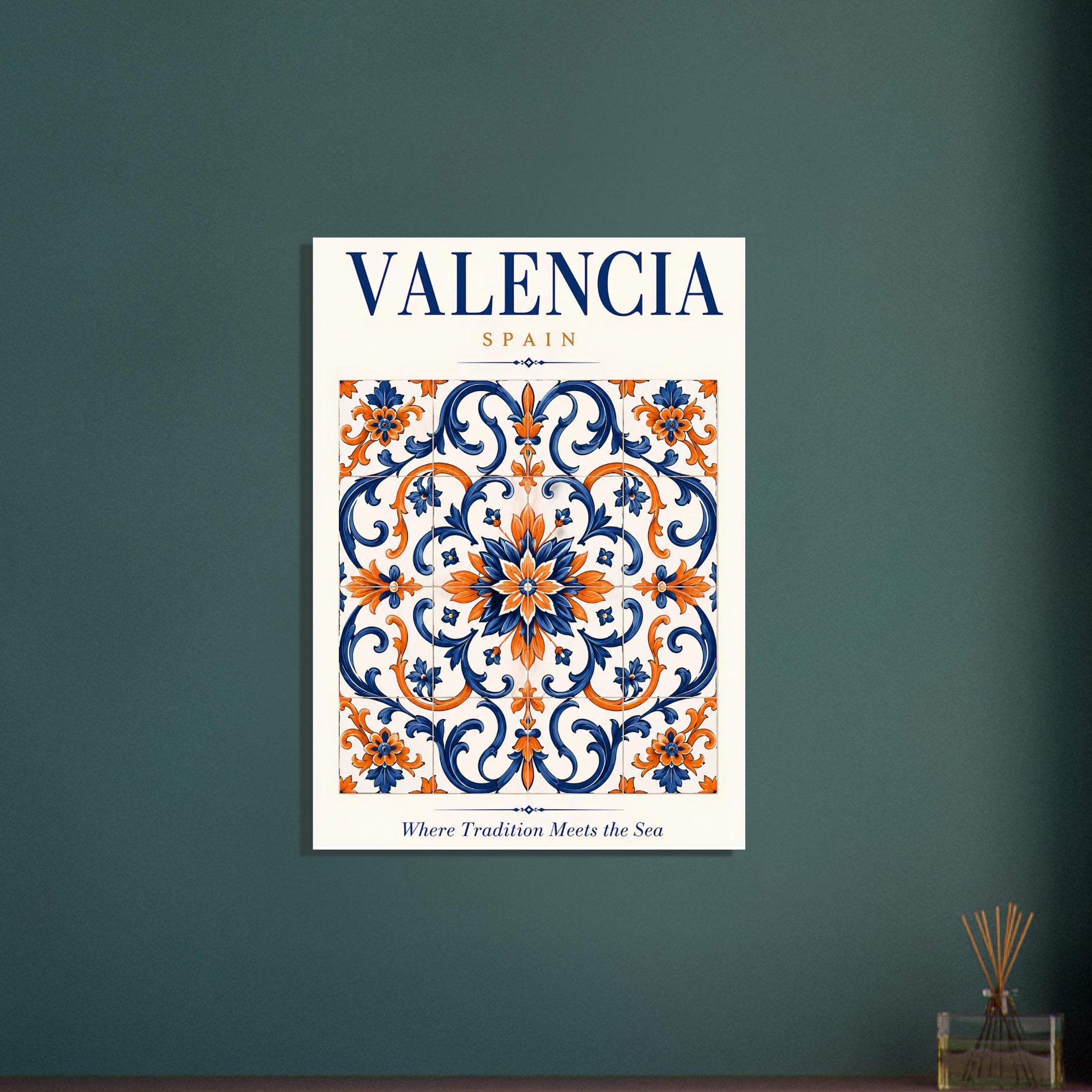 A vertical wall art print featuring a decorative Valencia, Spain tile pattern in navy blue and orange on a white background, mounted on a dark teal wall. The print includes the text 'VALENCIA SPAIN' at the top and 'Where Tradition Meets the Sea' at the bottom.