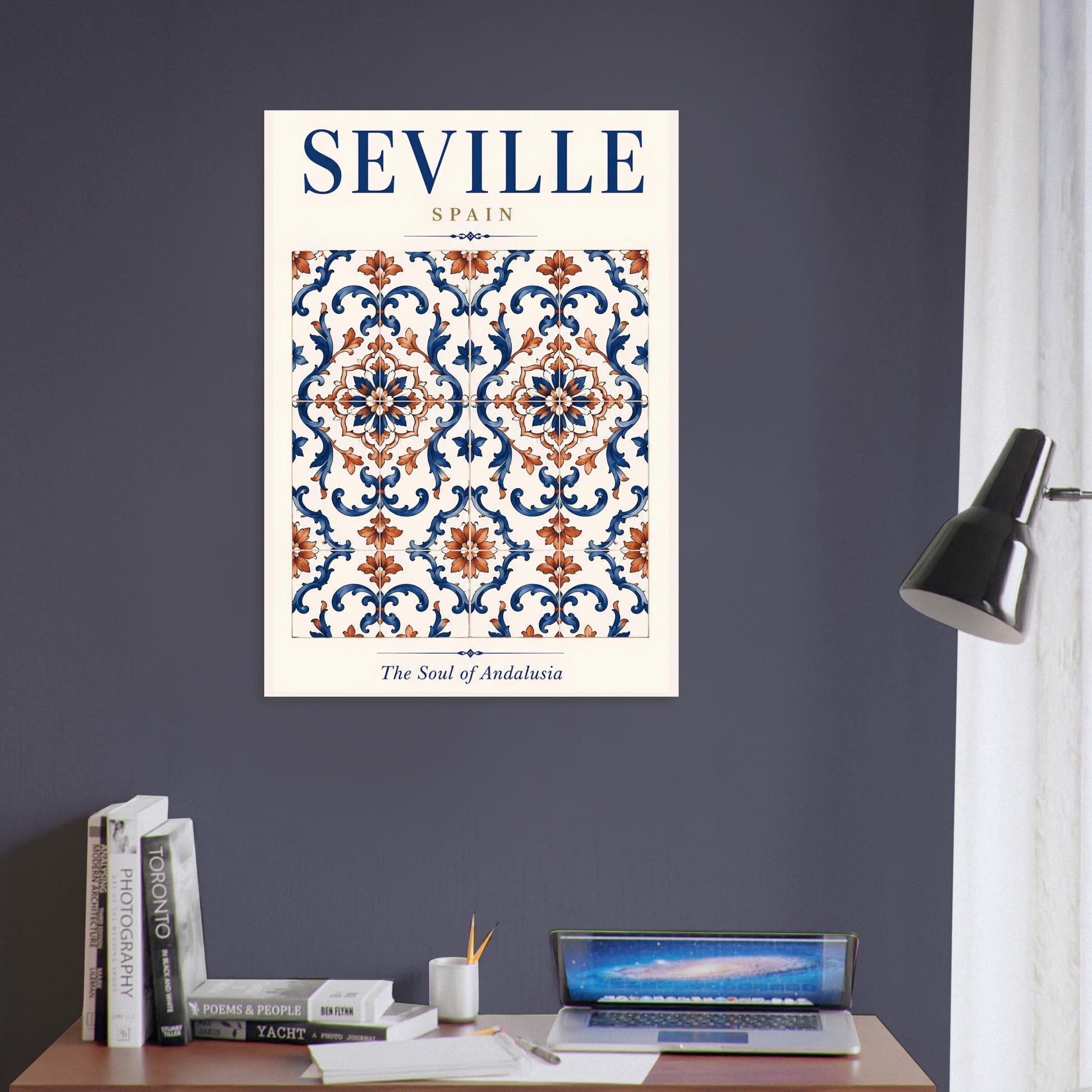 Seville travel poster featuring an ornate Spanish tile design displayed on a dark wall above a contemporary desk.