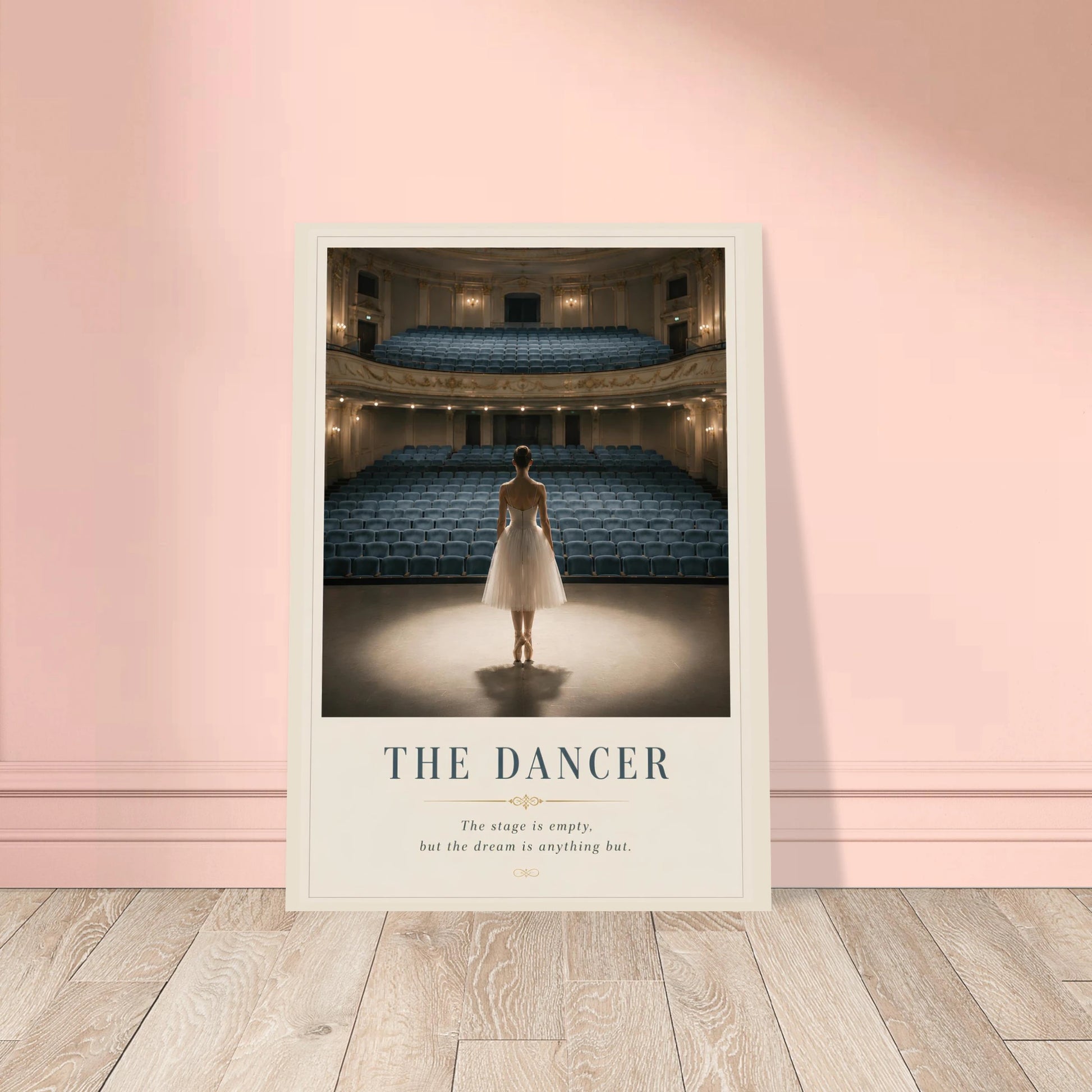 Framed poster of a dancer in an empty theater on a pink wall.