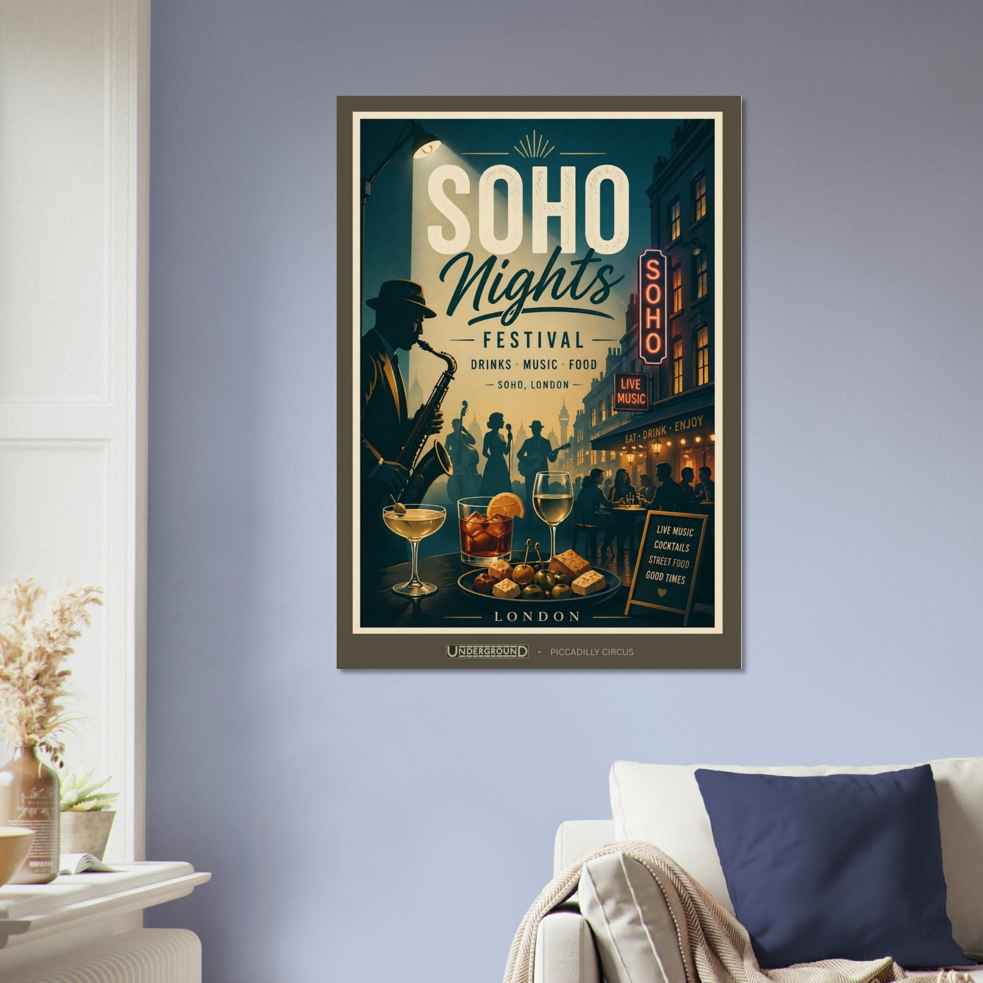 Framed poster of 'Soho Nights Festival' on a wall above a sofa.