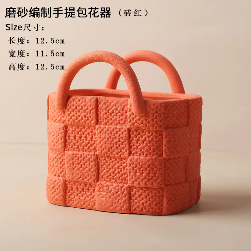 Orange woven handbag with handles on a beige background