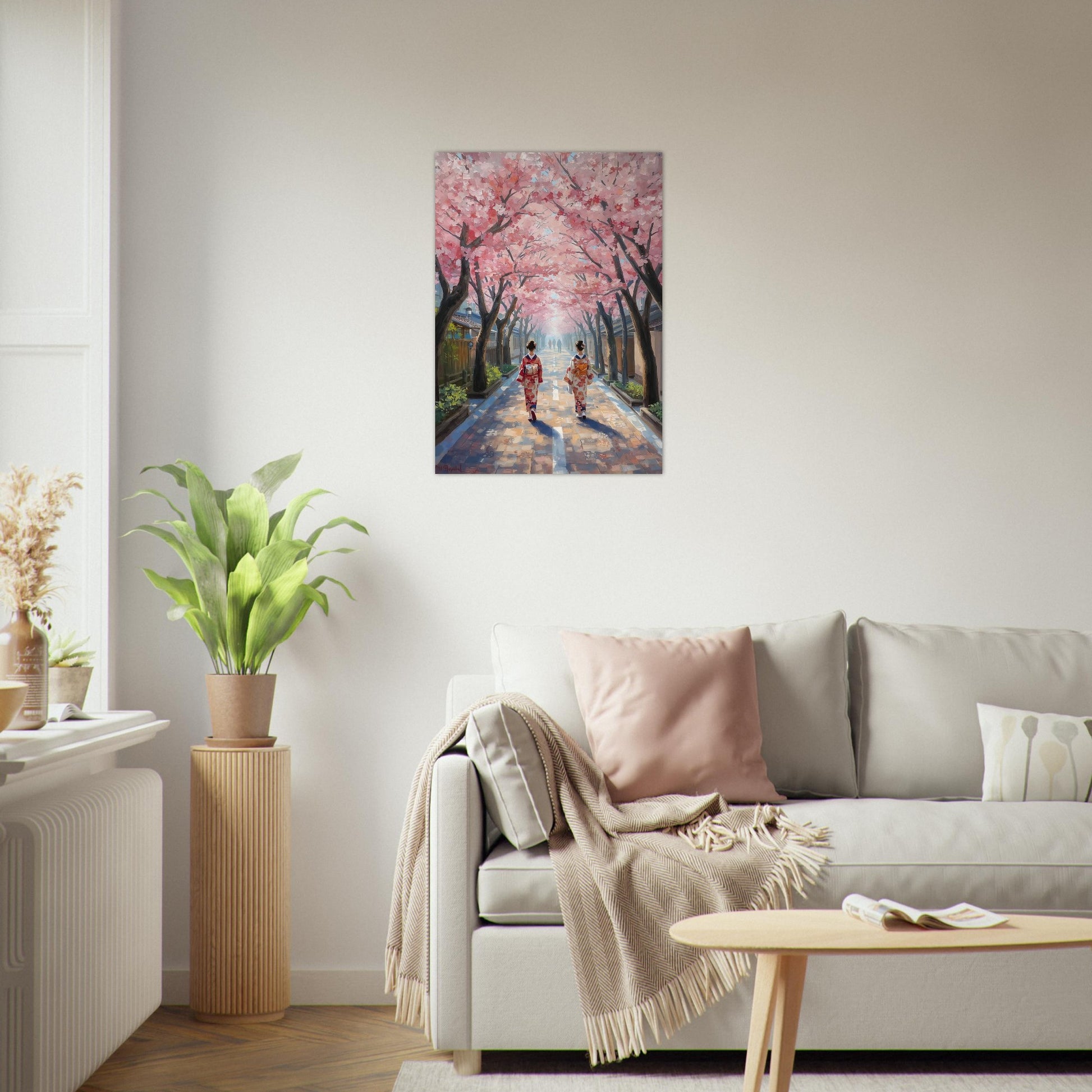 Living room with a painting of cherry blossoms on the wall above a sofa.