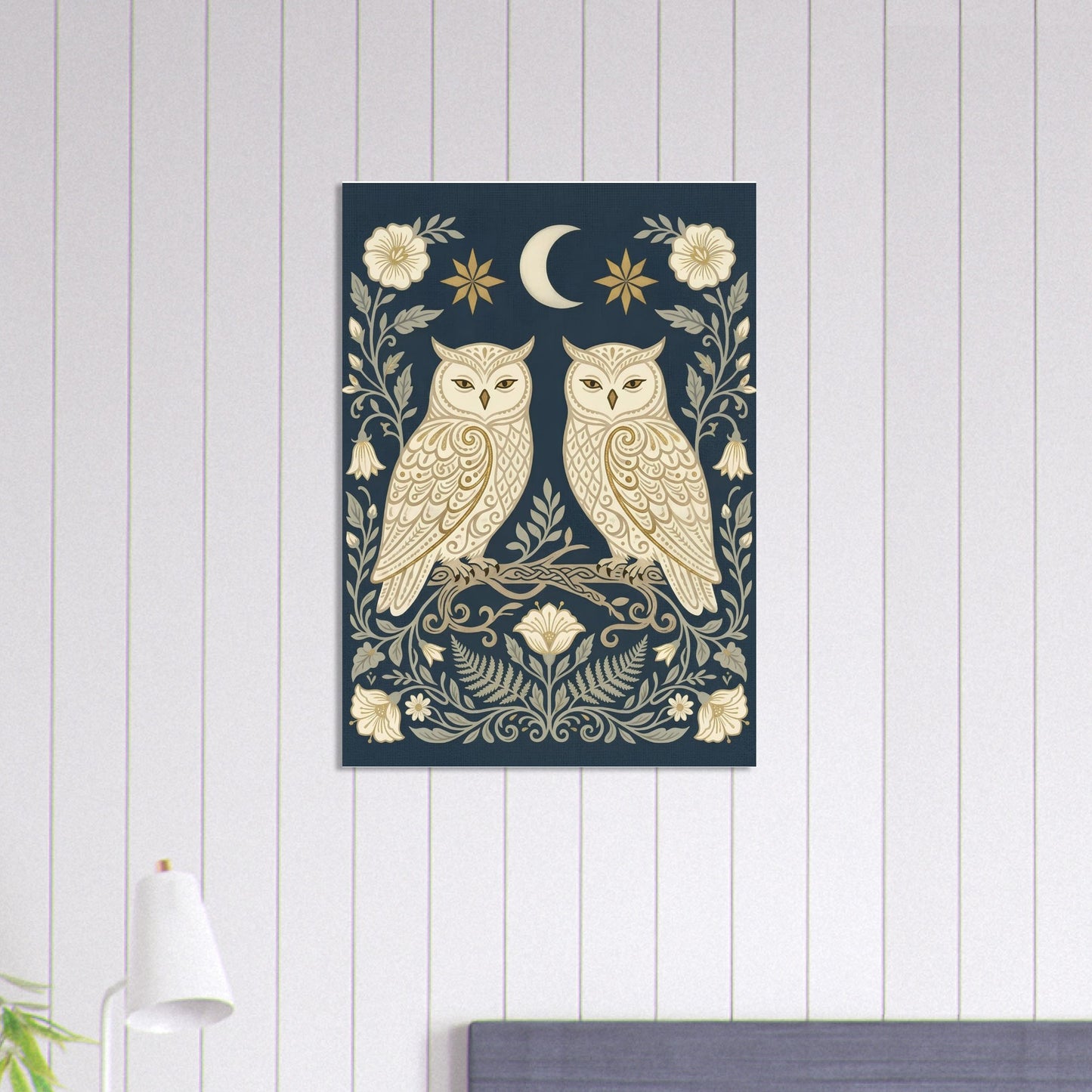 Owls & Moonflowers navy and cream folk art poster displayed in a modern interior with soft striped walls and minimalist décor.