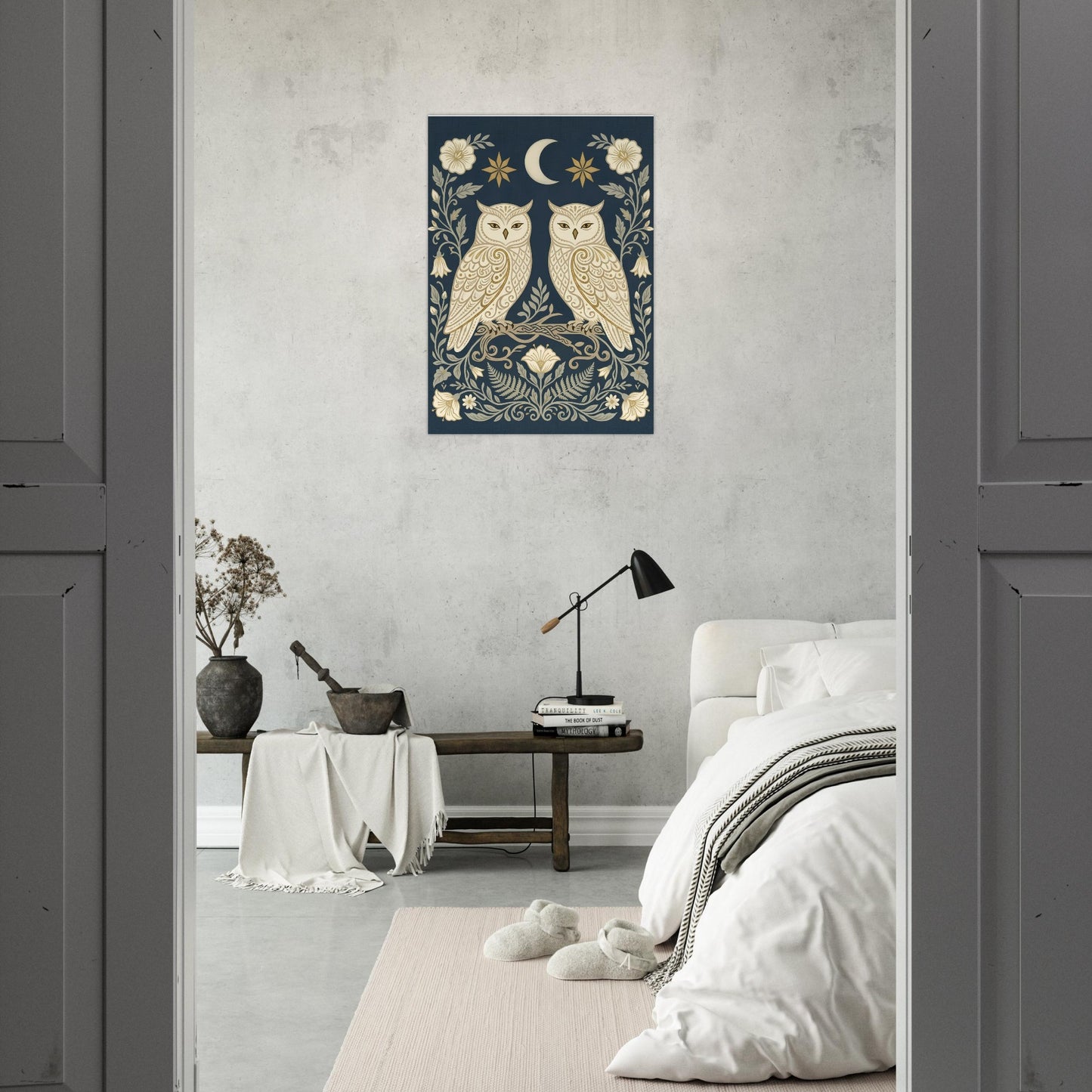 Owls & Moonflowers folk art wall print displayed above a bed in a contemporary grey and beige bedroom with calming neutral tones.