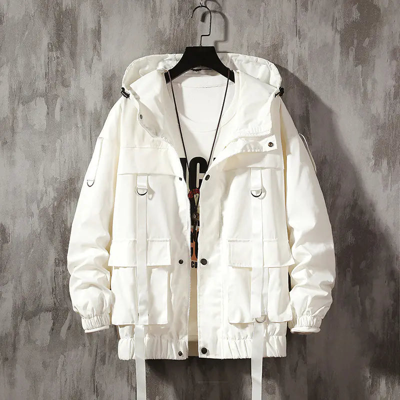 White jacket on a hanger against a gray textured wall
