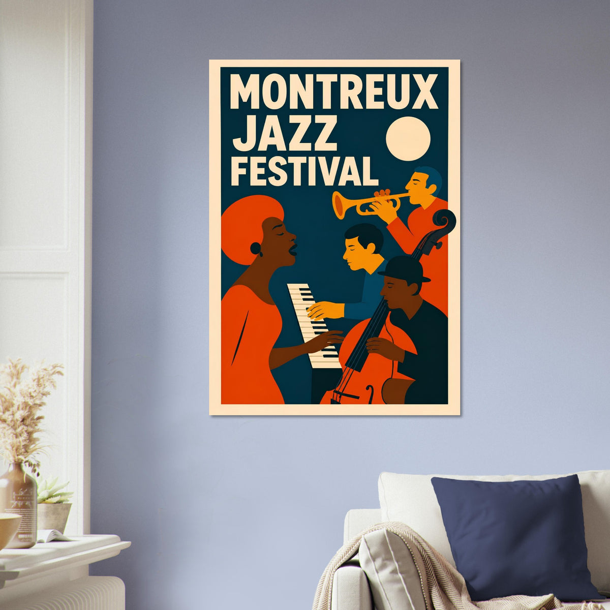 A framed poster reading 'MONTREUX JAZZ FESTIVAL' hangs on a light blue-gray wall above a sofa in a living room. The poster features a retro illustration of jazz musicians in orange, dark blue, cream, and black.